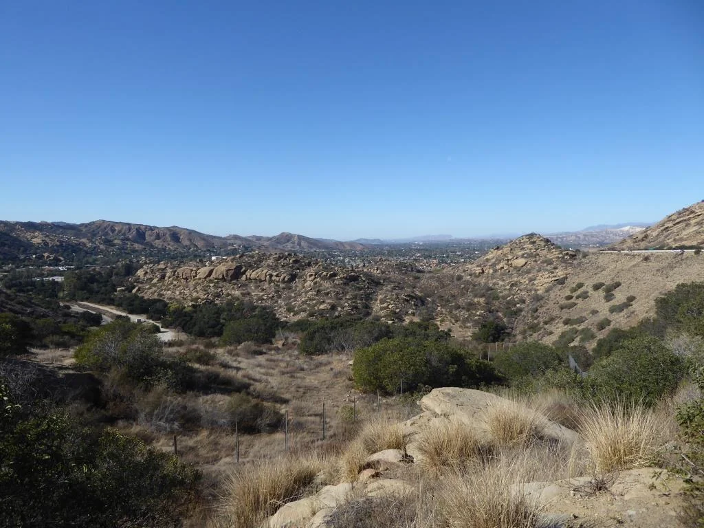 View of Corriganville Park from a trail on the east side of the park. The trail takes you up to 118 Freeway and a wildlife corridor tunnel that takes you under the freeway into Rocky Peak Park.