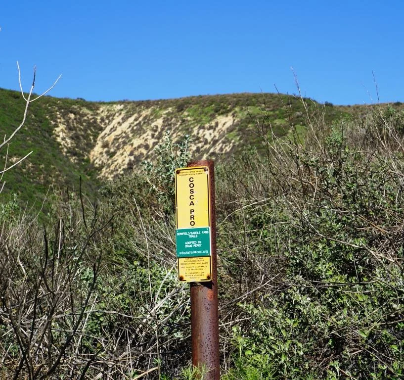 Small COSCA sign at the bottom of the steep hill from Canyon Oaks Park leading into the North Ranch Open Space.