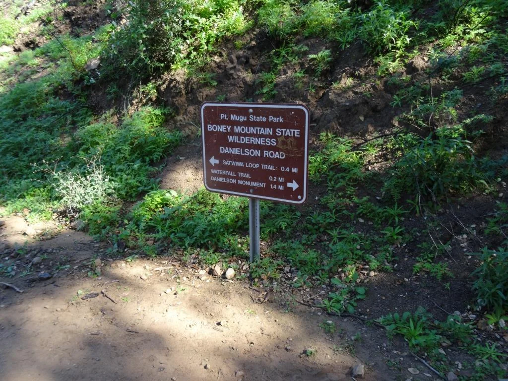 Danielson Road sign you will see at the east end of Upper Sycamore Canyon Trail, Now you can head back up towards Rancho Sierra Vista/Satwiwa to the left or go the The Waterfall and/or Danielson Monument.