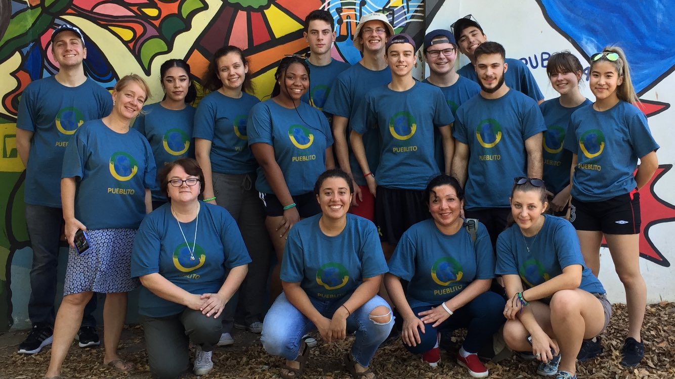 Ashley (front row, second from the left) with the Global Education delegations from St. Augustine and St. Augustine and Cardinal Leger schools