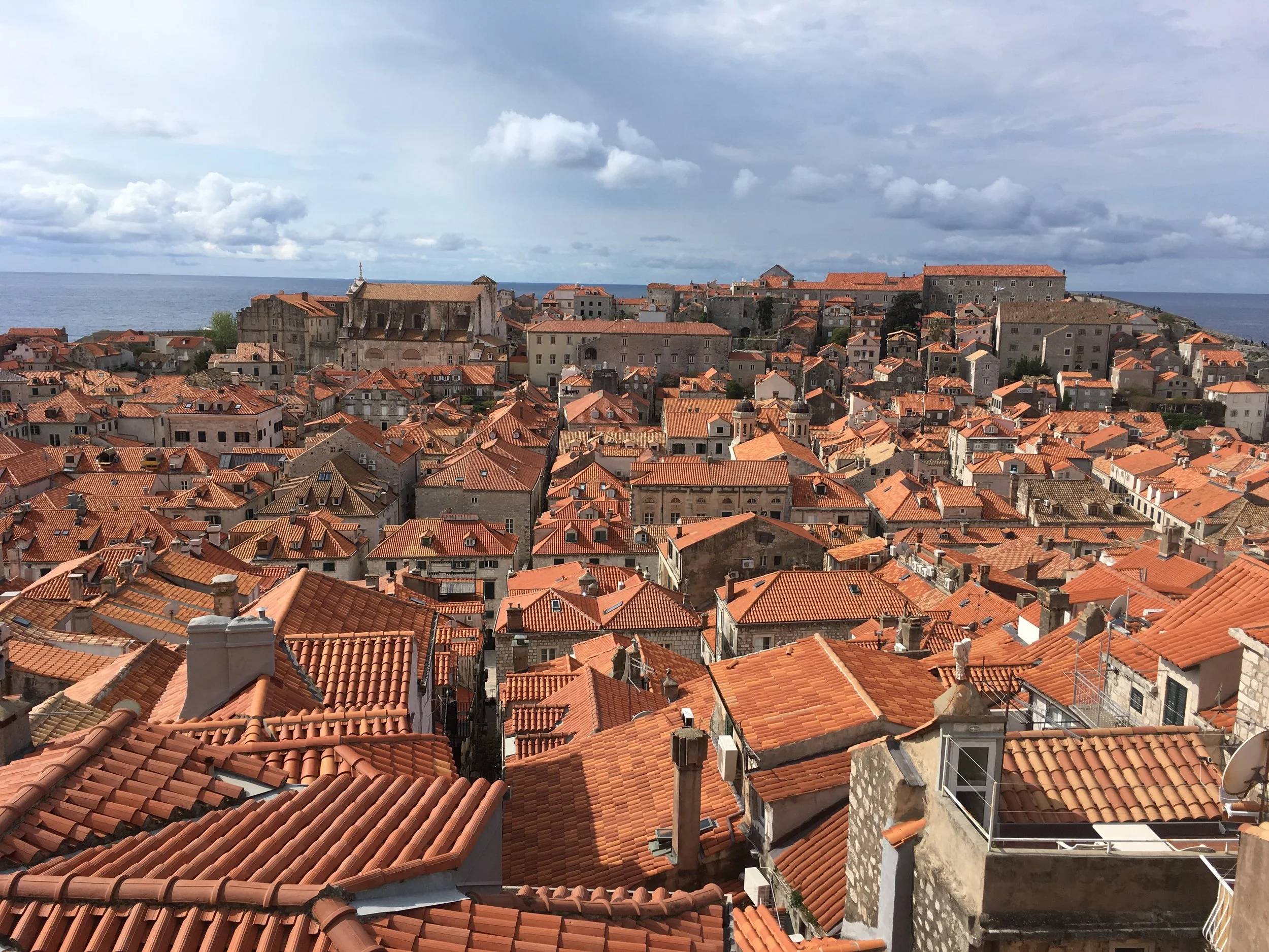 Newer, more orange tiles show the repaired roofs from the Siege of Dubrovnik in the 1990's.