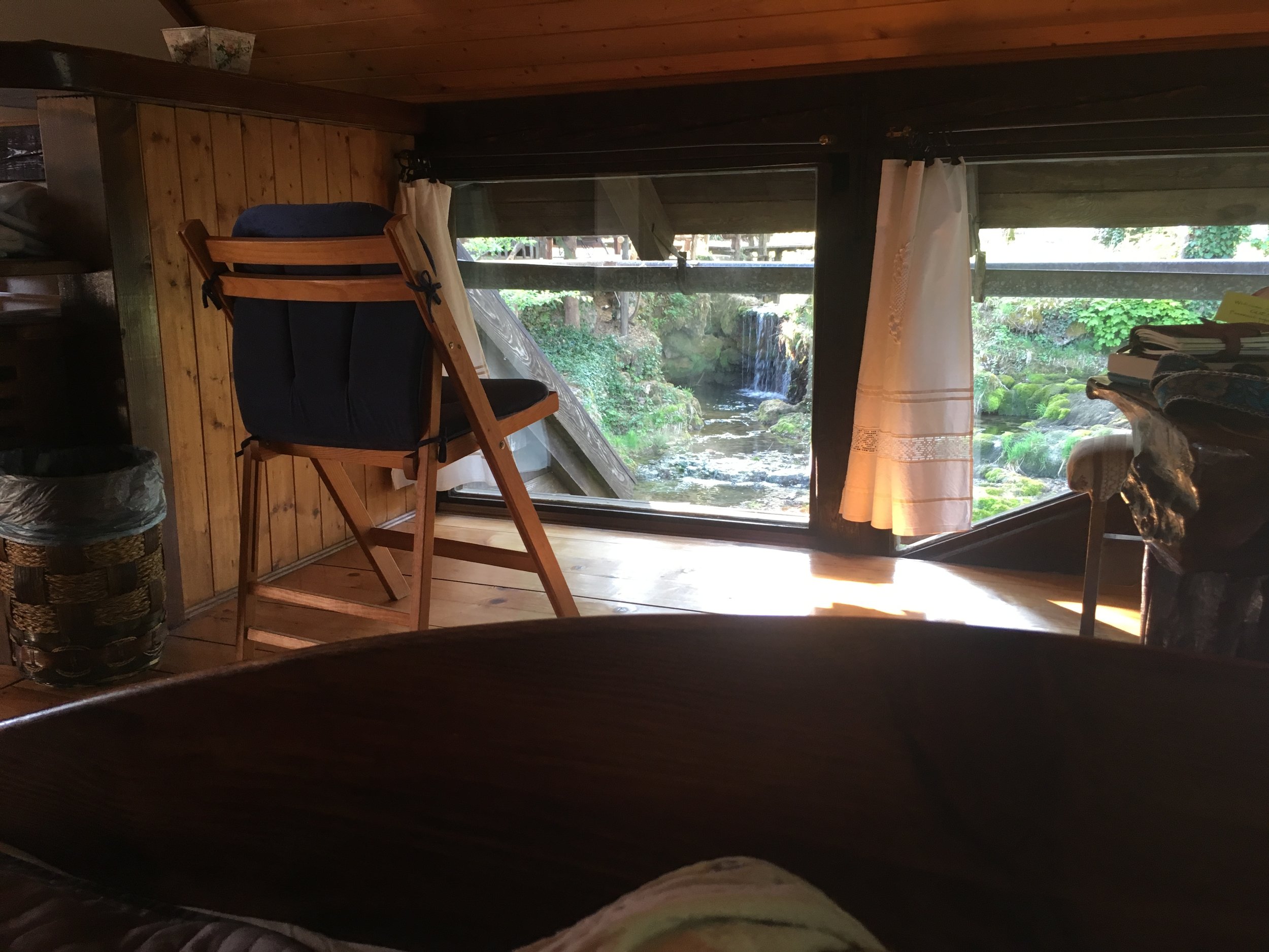 From the bungalow's bed, you can see waterfalls