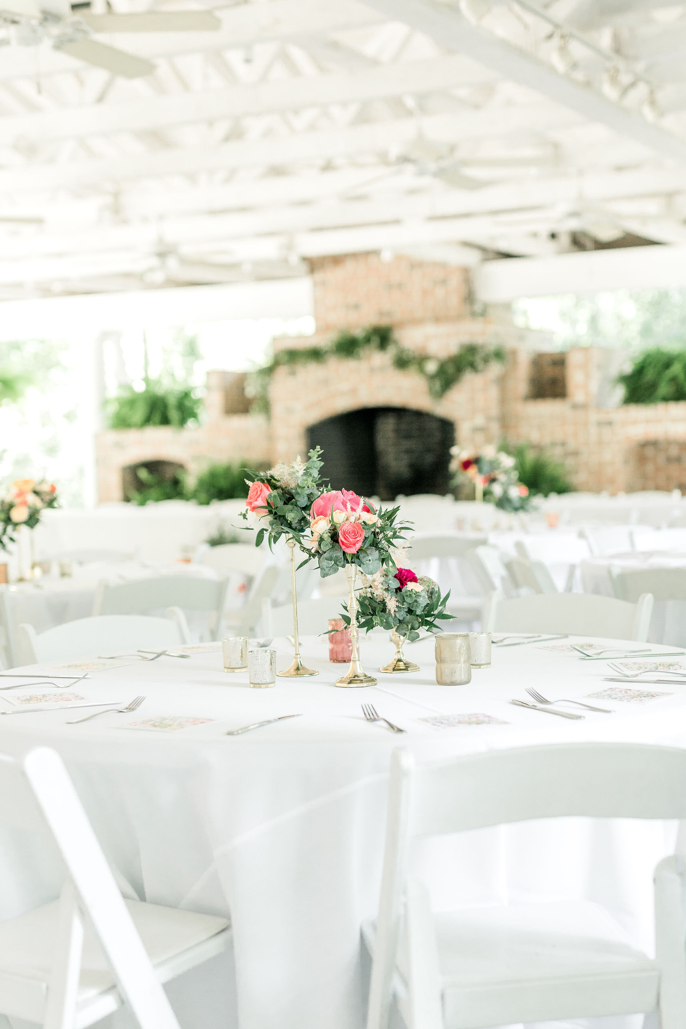 candlestick-centerpiece-hot-pink-flowers-boho-center-piece-tall-centerpieces-savannah-wedding-candle-centerpiece-white-and-hot-pink-centerpice-mackey-hosue-wedding-greenery-and-cloral-flowers.jpg