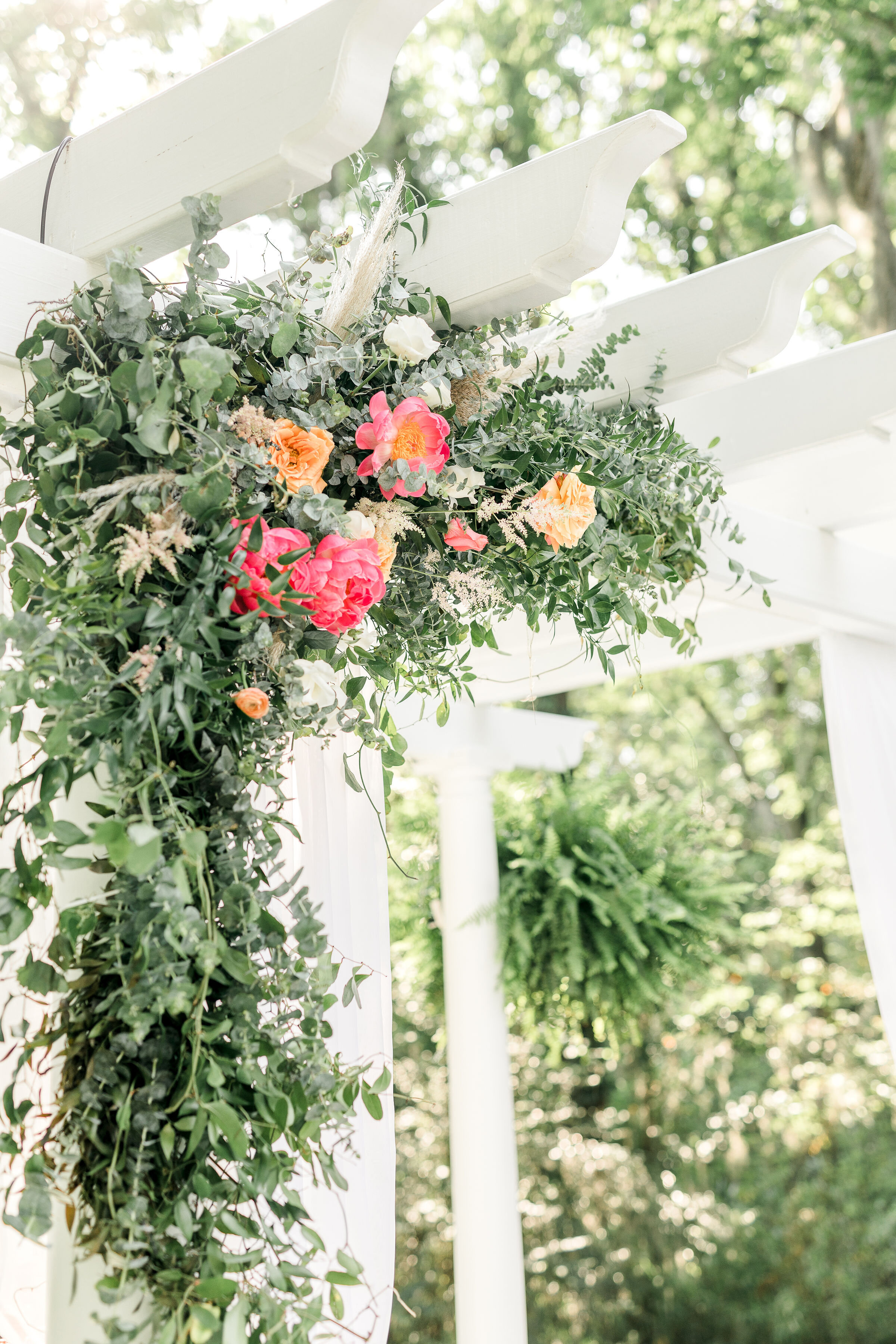 hanging-flower-design-pink-and-green-flowers-ceremony-backdrop-flowers-greenery-southern-wedding.jpg
