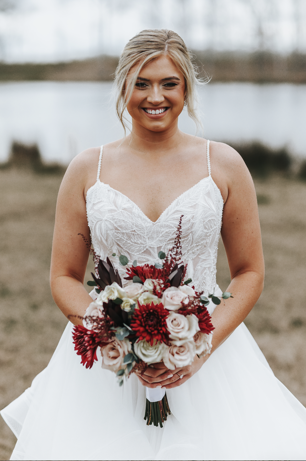 real-savannah-bride-rebecca-wearing-the-timbrey-gown-by-maggie-sottero-romantic-ballgown-with-tiered-tulle-skirt-horsehair-trim-spaghetti-straps-lace-purchased-from-savannah-bridal-shop-and-savannah-bridal-boutique-ivory-and-beau-3.png