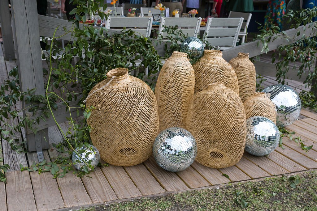 rattan pendant and disco ball wedding reception decor