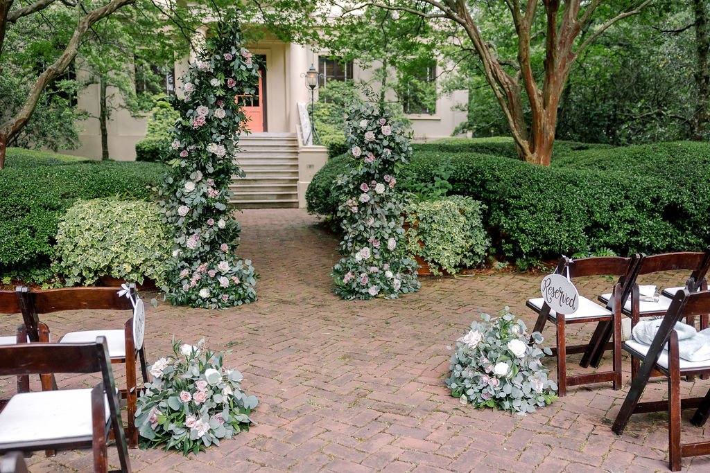 organic garden wedding with rose arch