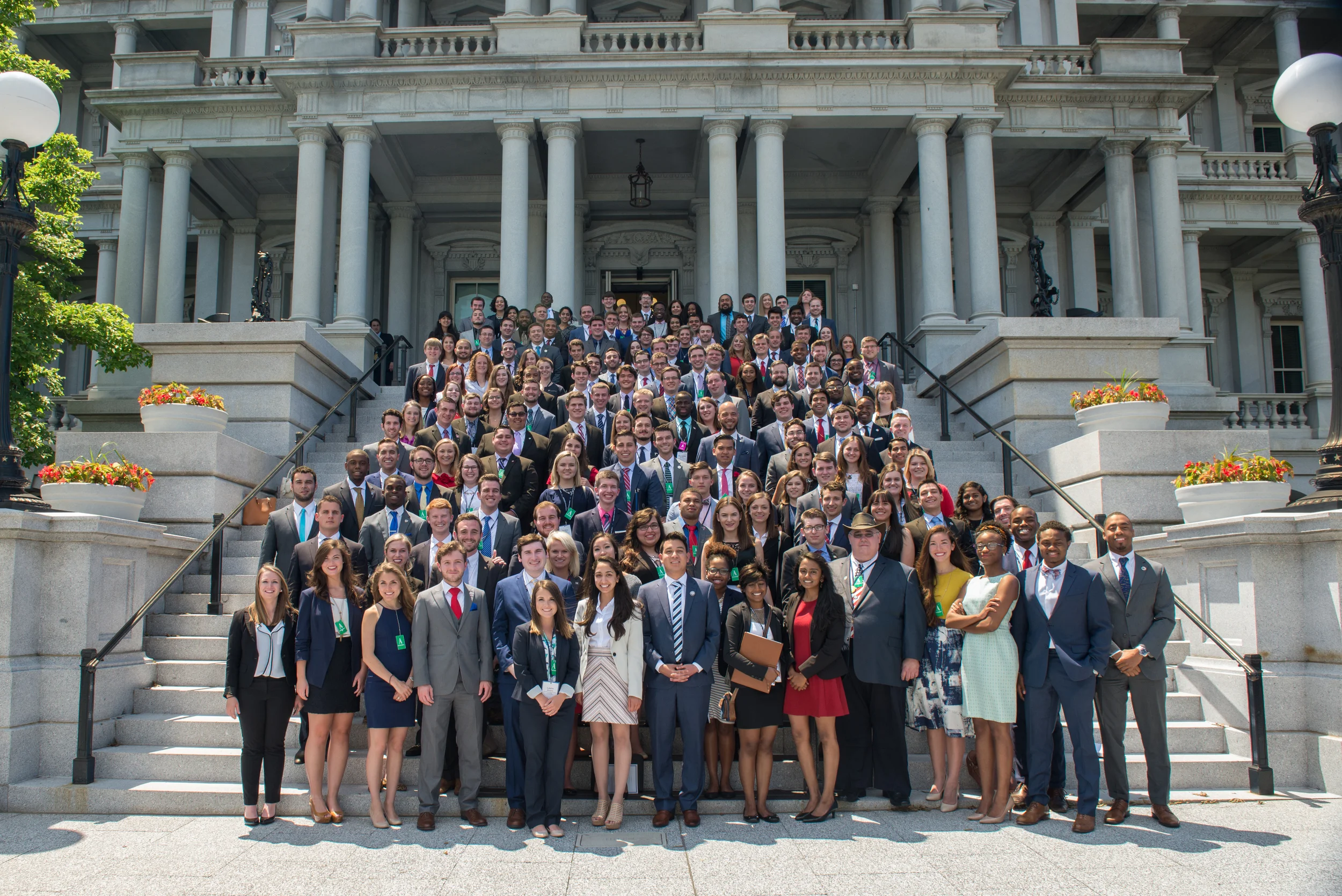 The whole group outside the White House Eisenhower Executive Office Building.