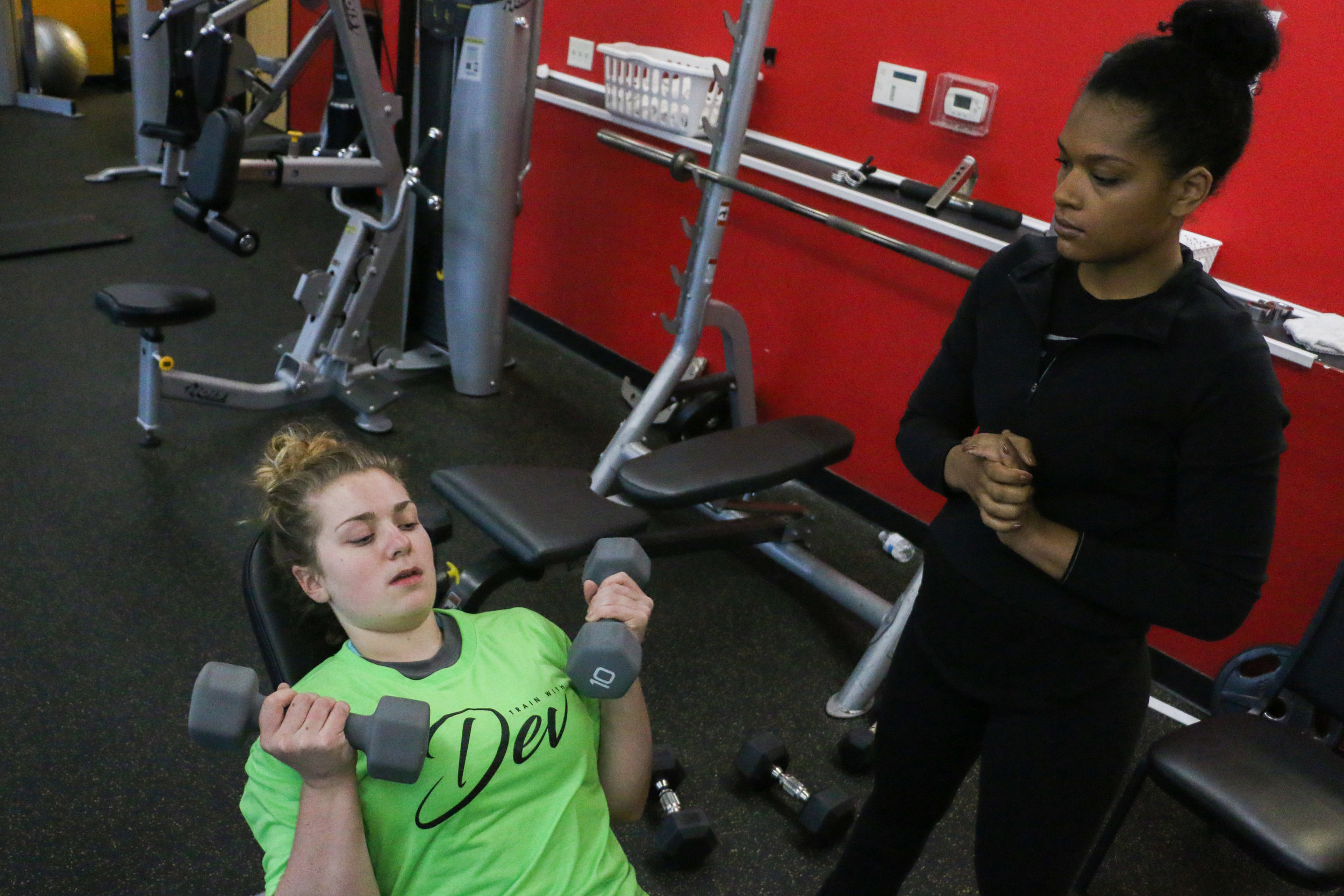 Devin Wilmott, personal trainer and 2017 graduate of Iowa State, works with Taylor Schumacher to help rebuild her strength after being diagnosed with postural orthostatic tachycardia syndrome (POTS). Wilmott modifies Schumacher's exercises to where