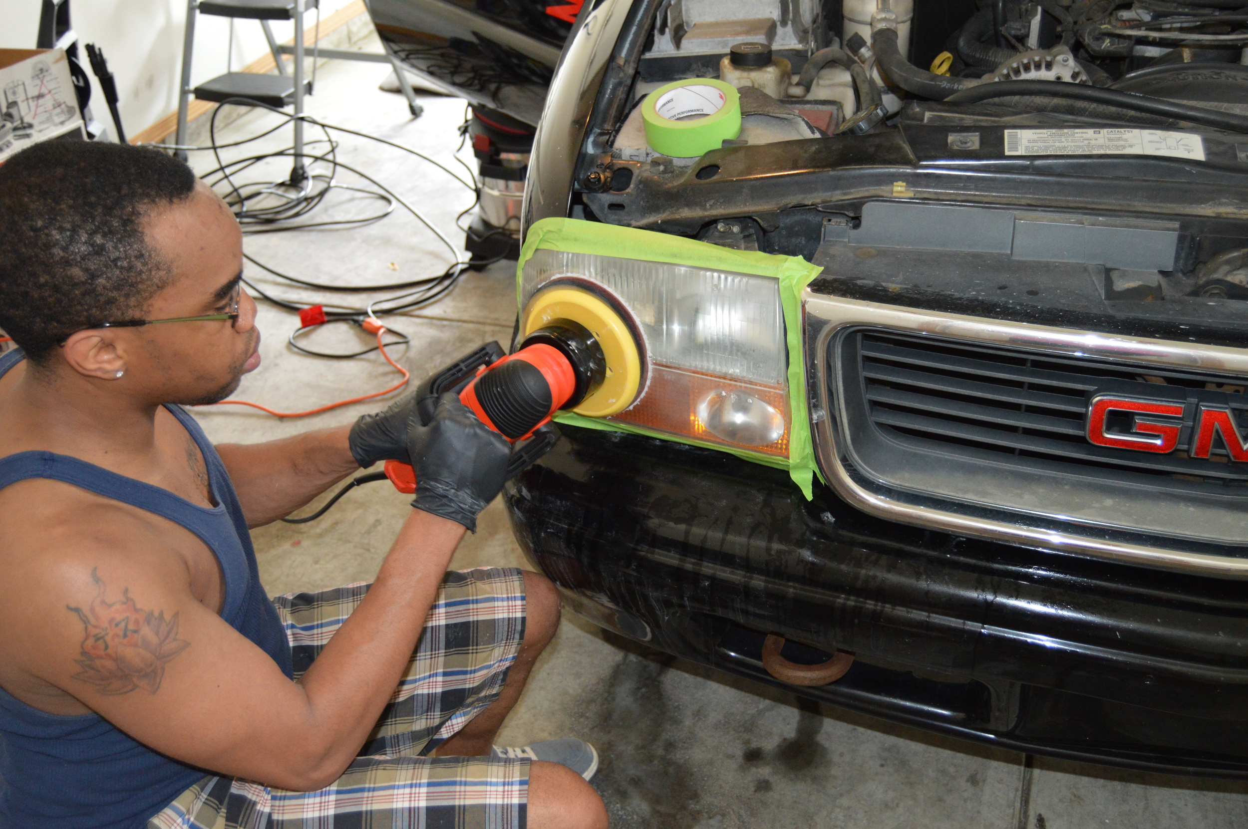 After sanding off headlight oxidation headlights are polished to a like new state.