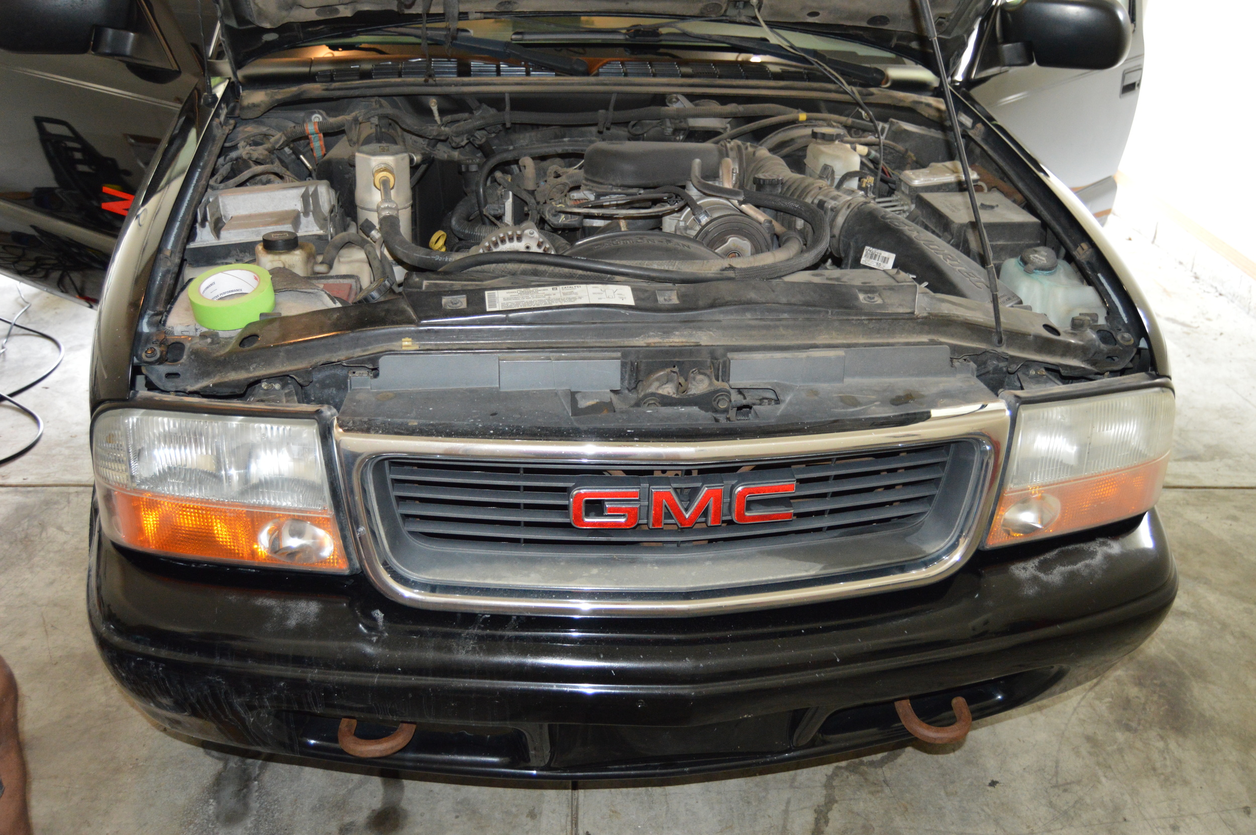 50/50 showing left headlight restored. You can see the excessive dust in the engine from years of neglect