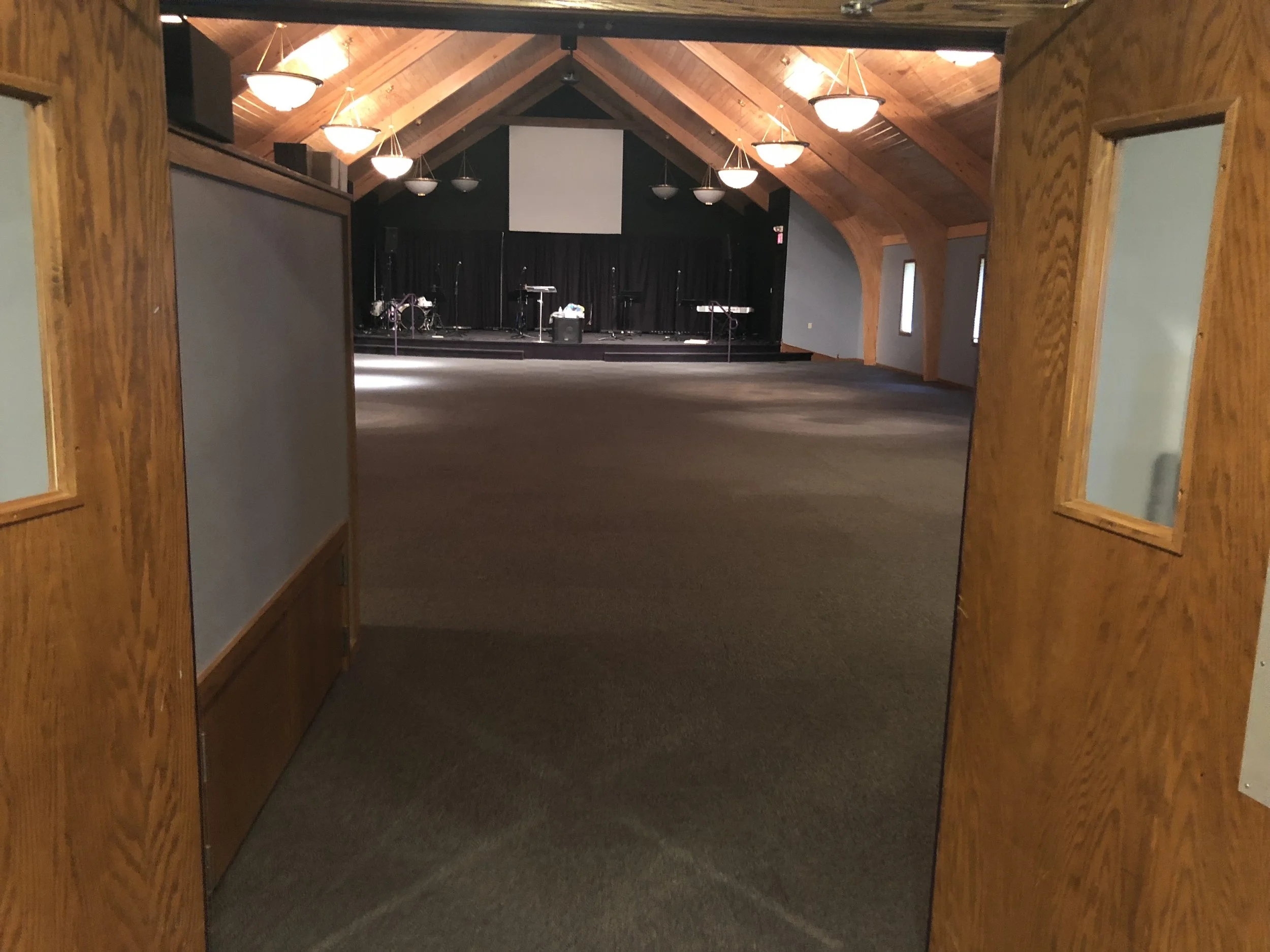 View of an empty sanctuary newly carpeted floor.