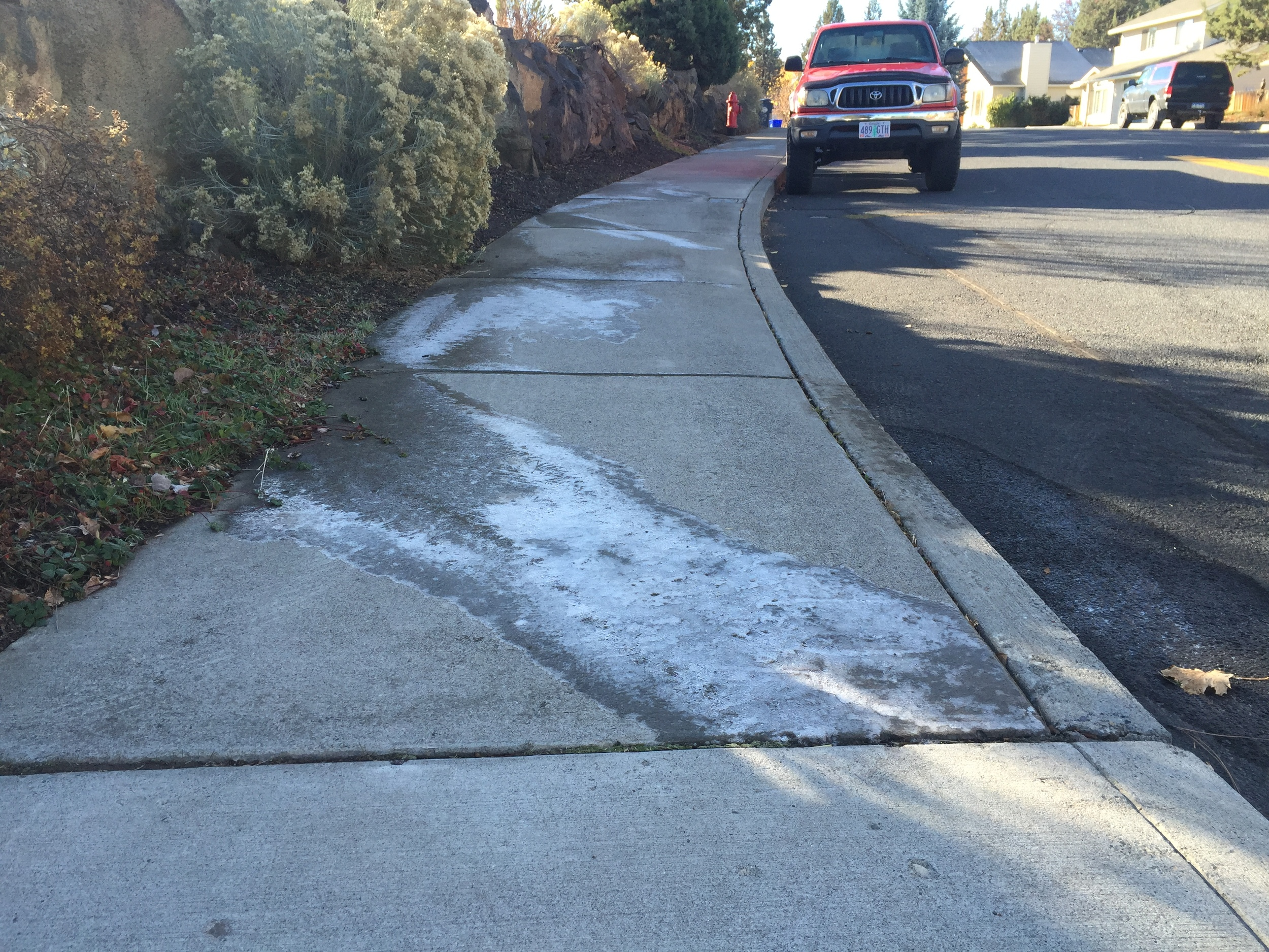 Sprinklers causing ice on sidewalk in Bend, OR