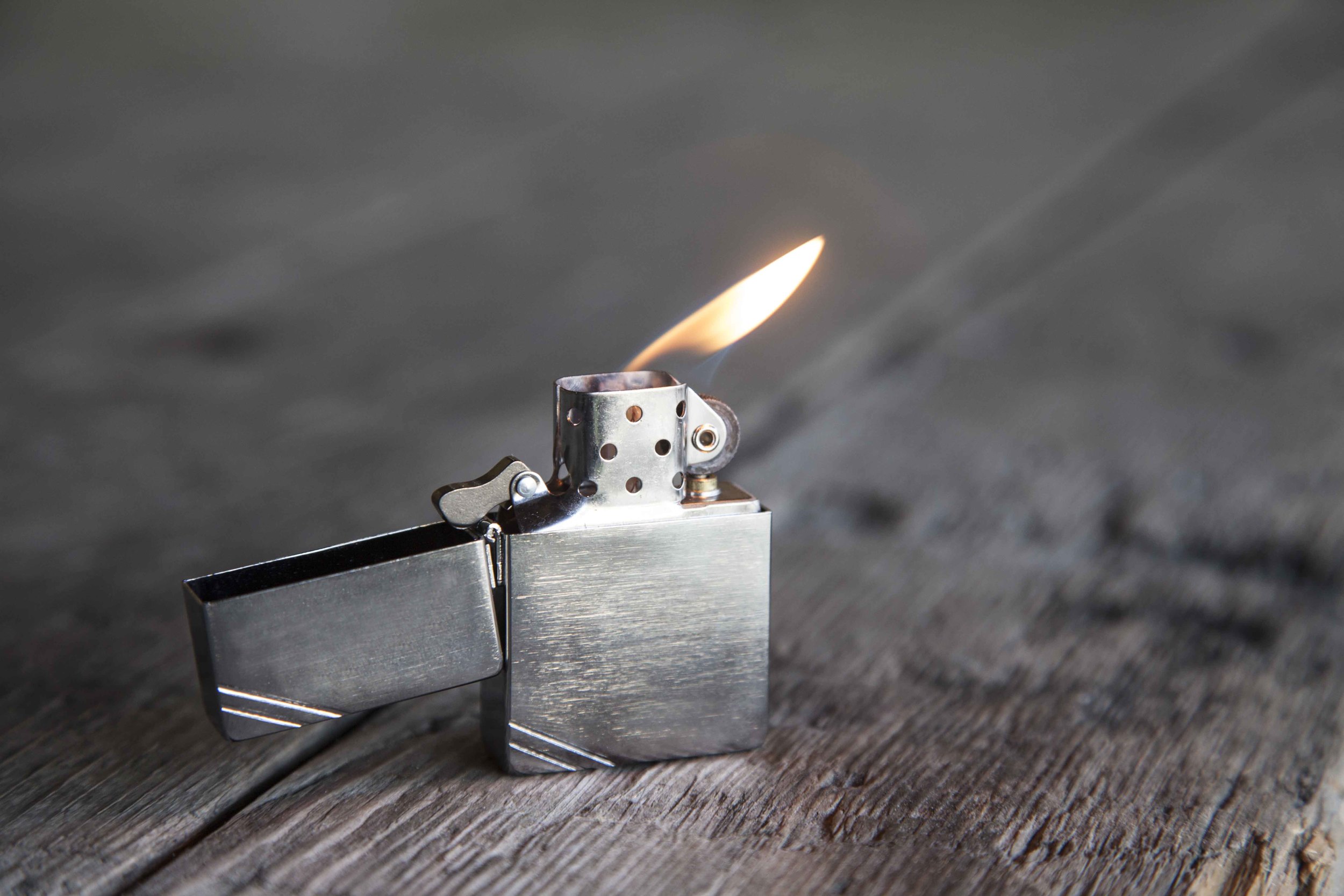 your Zippo, followed by the grind of the wheel on the flint as it ignites t...