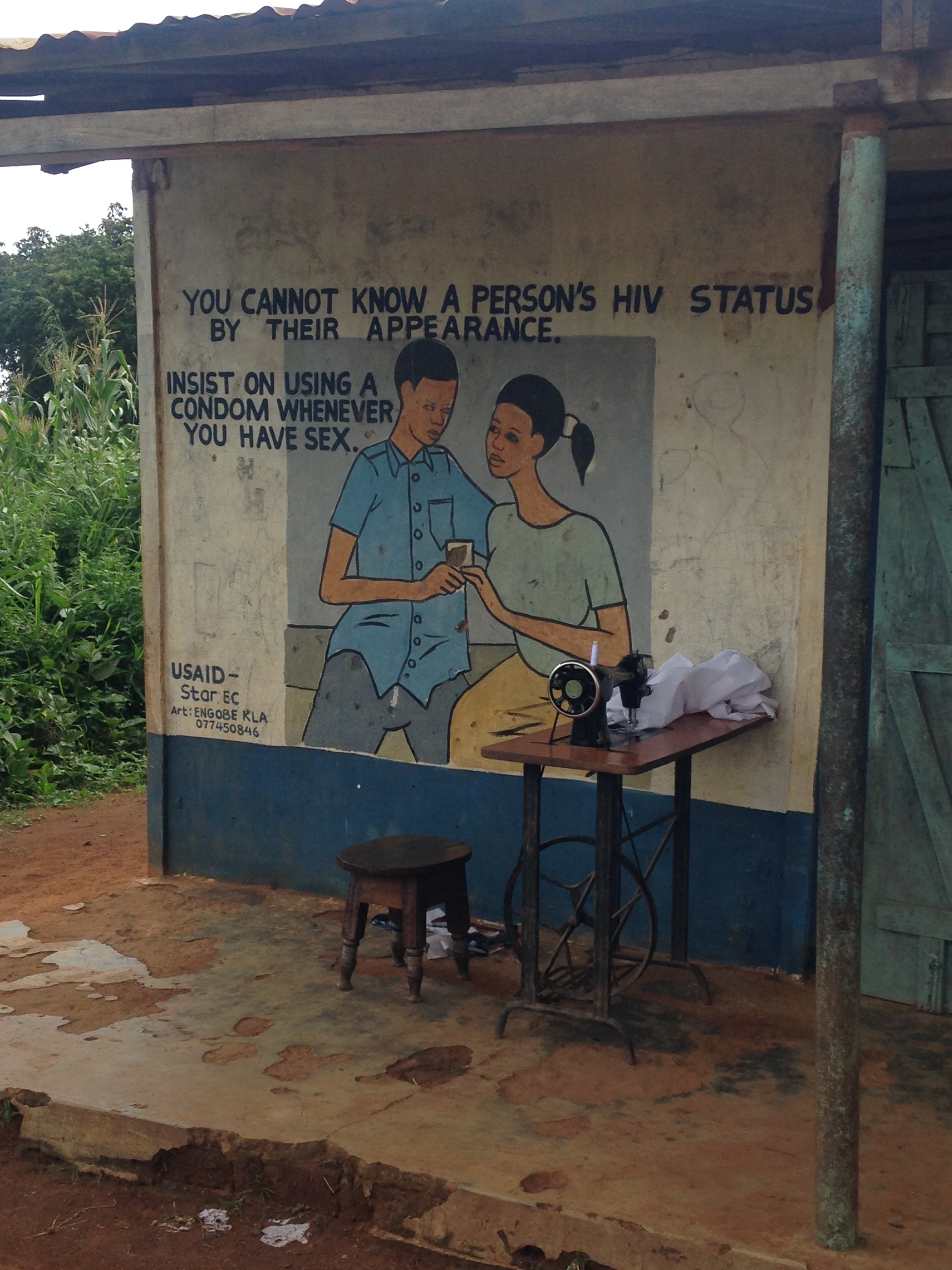 HIV/AIDS testing awareness advertisement seen on the side of a local shop on Sigulu Island.