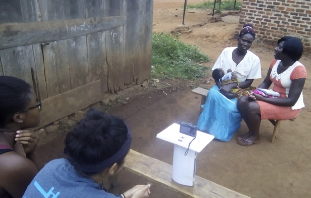 Rachel, a fellow UDHA intern, surveying a woman about her nutrition practices.