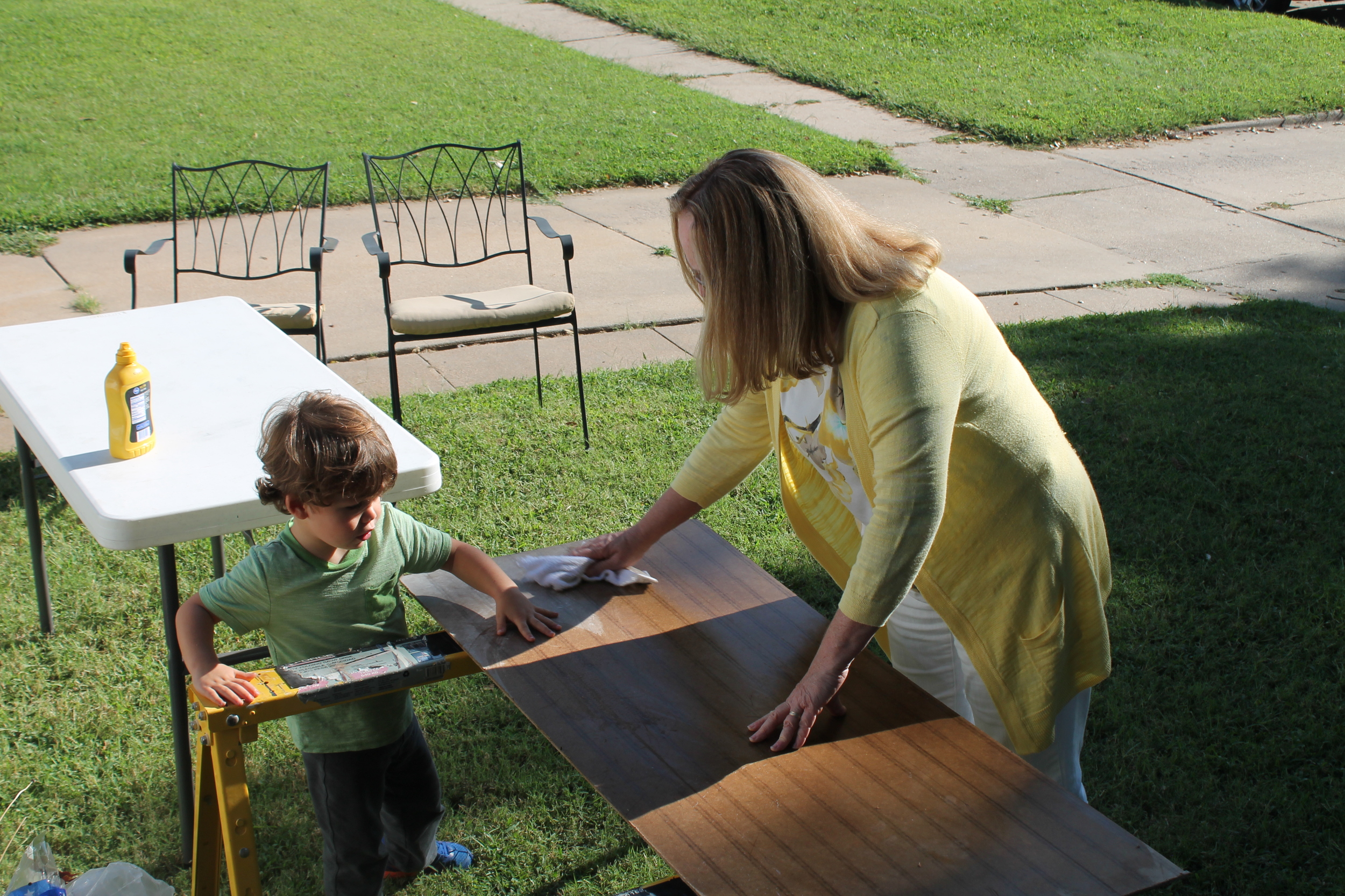 Many hands made light work of setting up for our block party. I think Prescott was inspecting the quality of Elaine's work. 