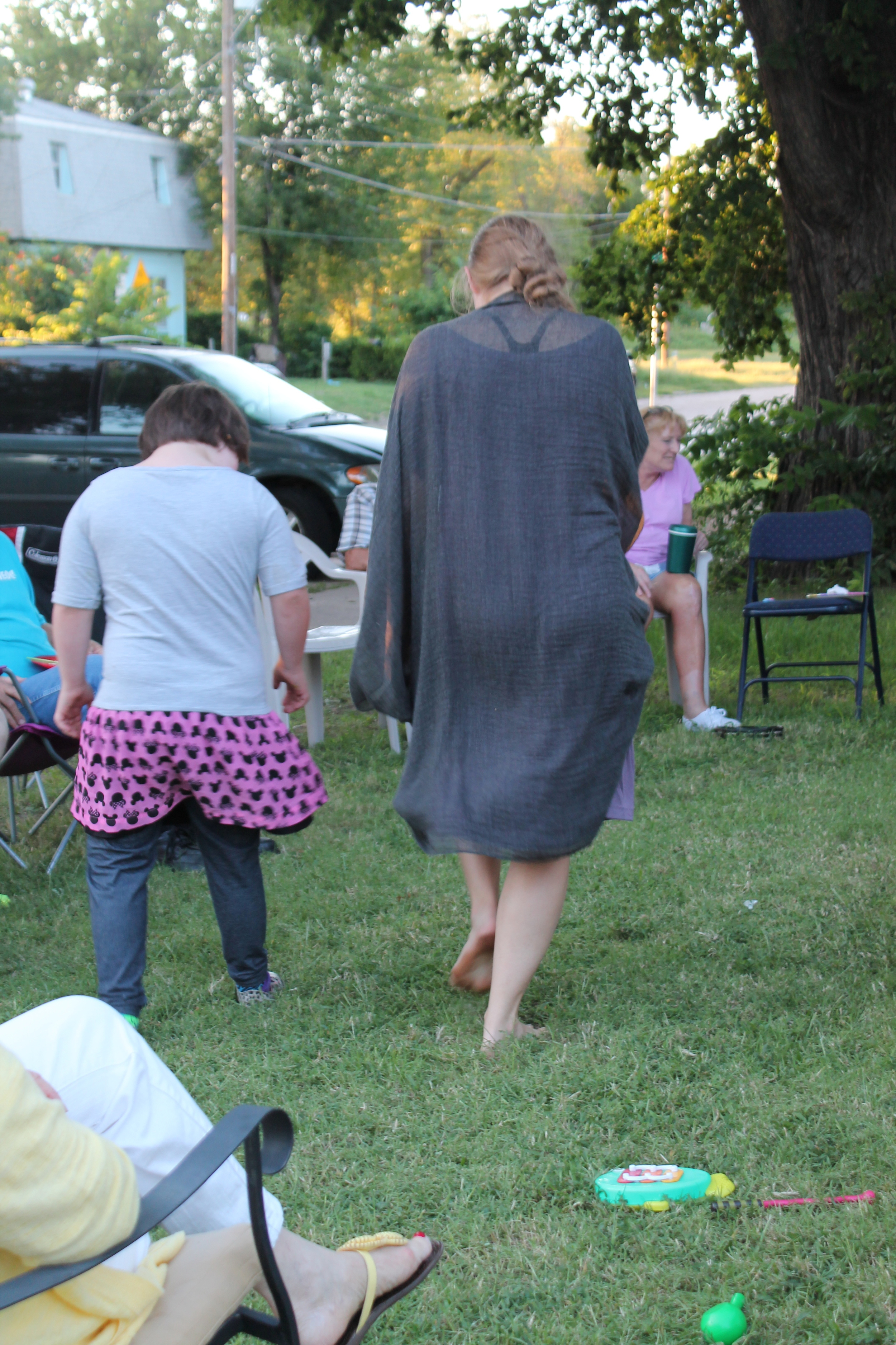 Sami, one of our immersion students, teaches a dance step to one of the neighborhood kids during the party. Who would have ever guessed there would be dancing happening in our front yard? 