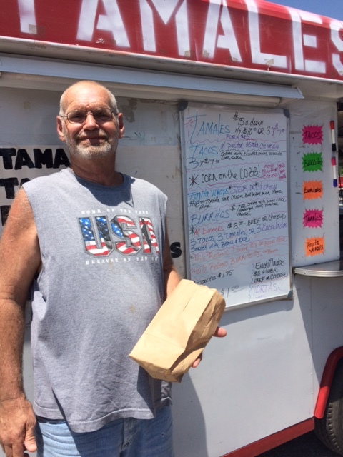 Professor Food (aka Mark) stands beside Monica's food truck! 