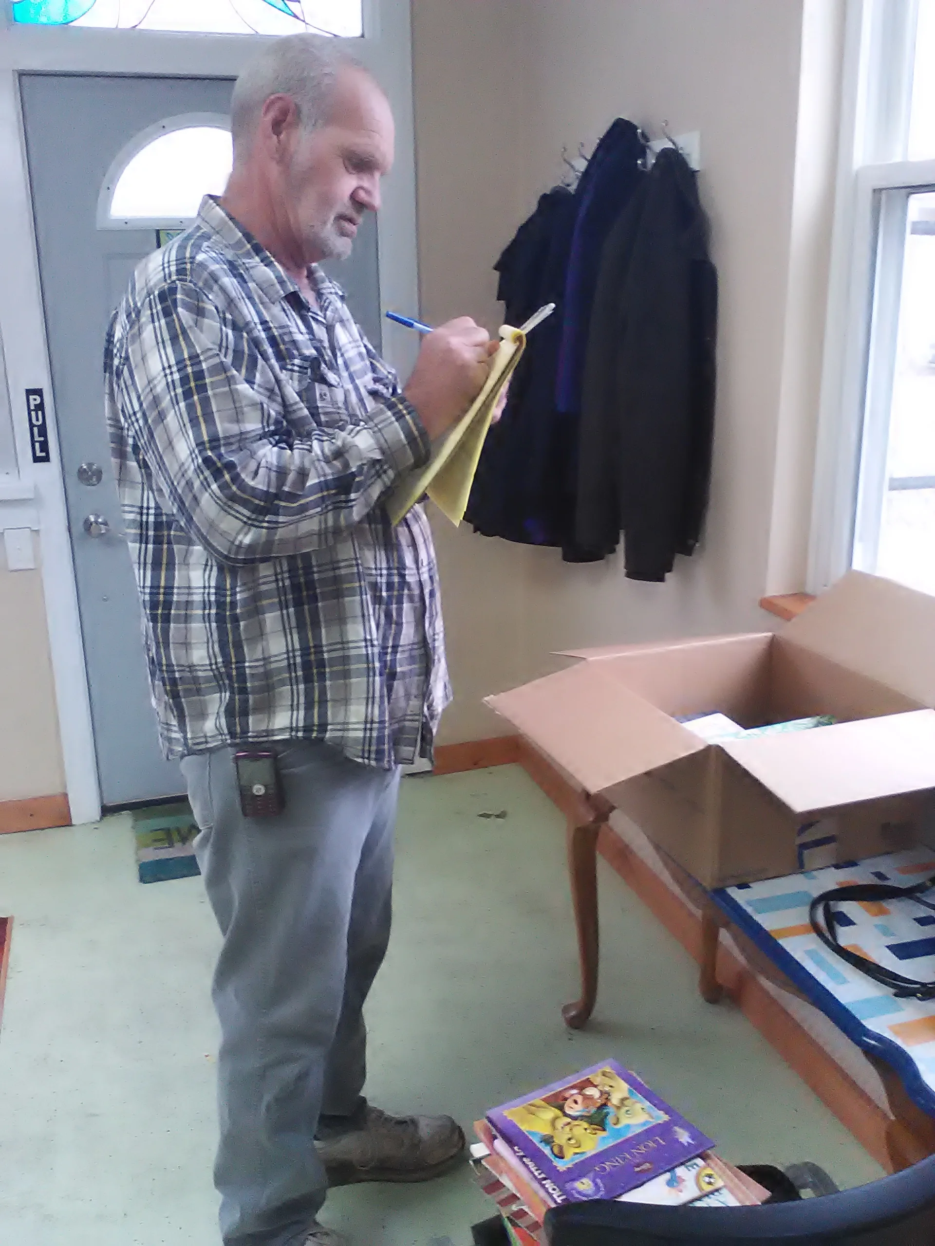 Mark prepares the Little Free Library books. 