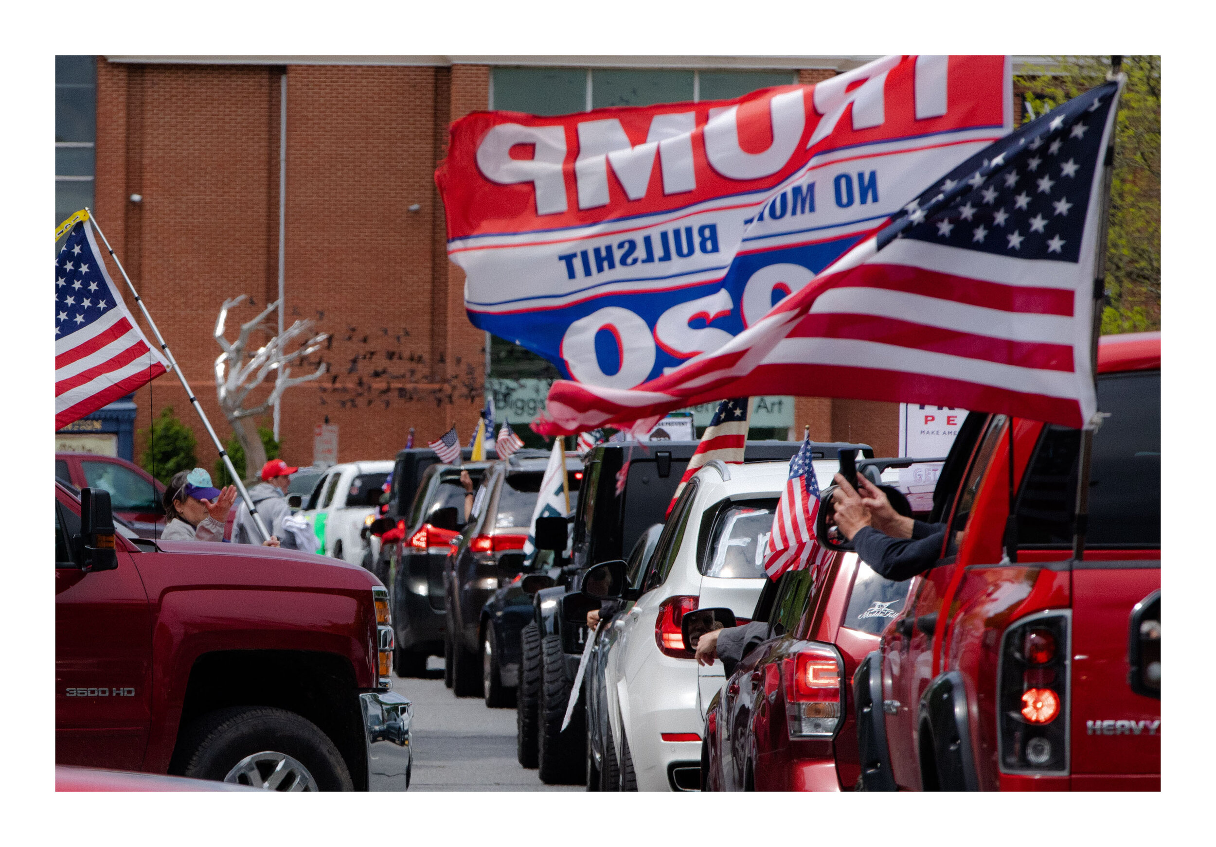  On May 1st, 2020, demonstrators joined together in Dover, Delaware to protest Govenor John Carney’s decision to close the state down. A large amount of armed protestors arrived, as well as families. A daughter stands next to her armed parents.  