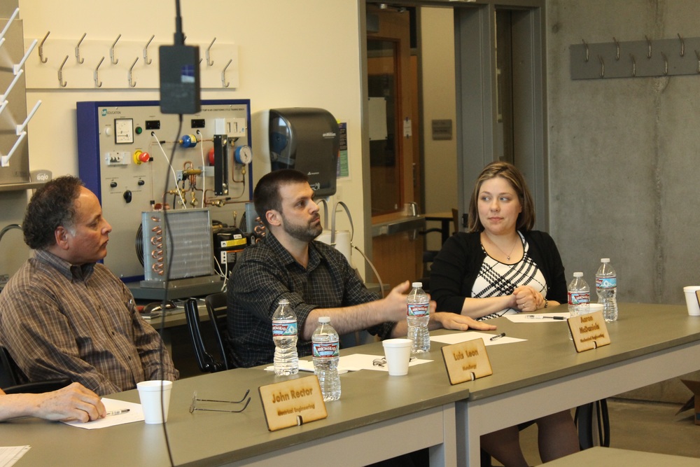  PCS teammate, Aaron McDaniel (center), answers a question at the UW Bothell's ASME panel. April 8, 2016. 