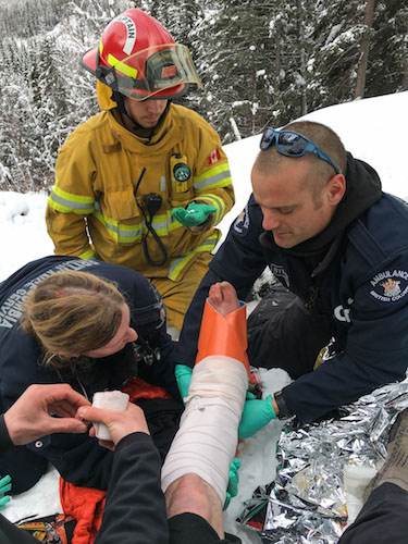 Medics attend to Andronowski's ankle before he is helicoptered to the hospital.
