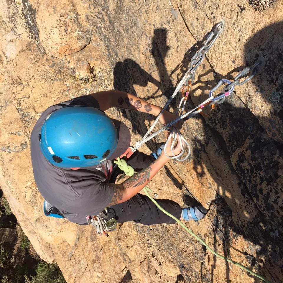 AAC Member Marsha Texeira anchored and rigging a toprope anchor. Photo cred: Jonathan Wachtel