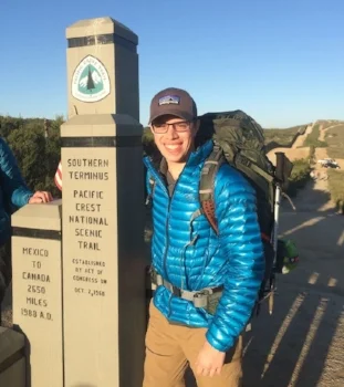 Marcus at the start of the Pacific Crest Trail by the U.S.-Mexico border.