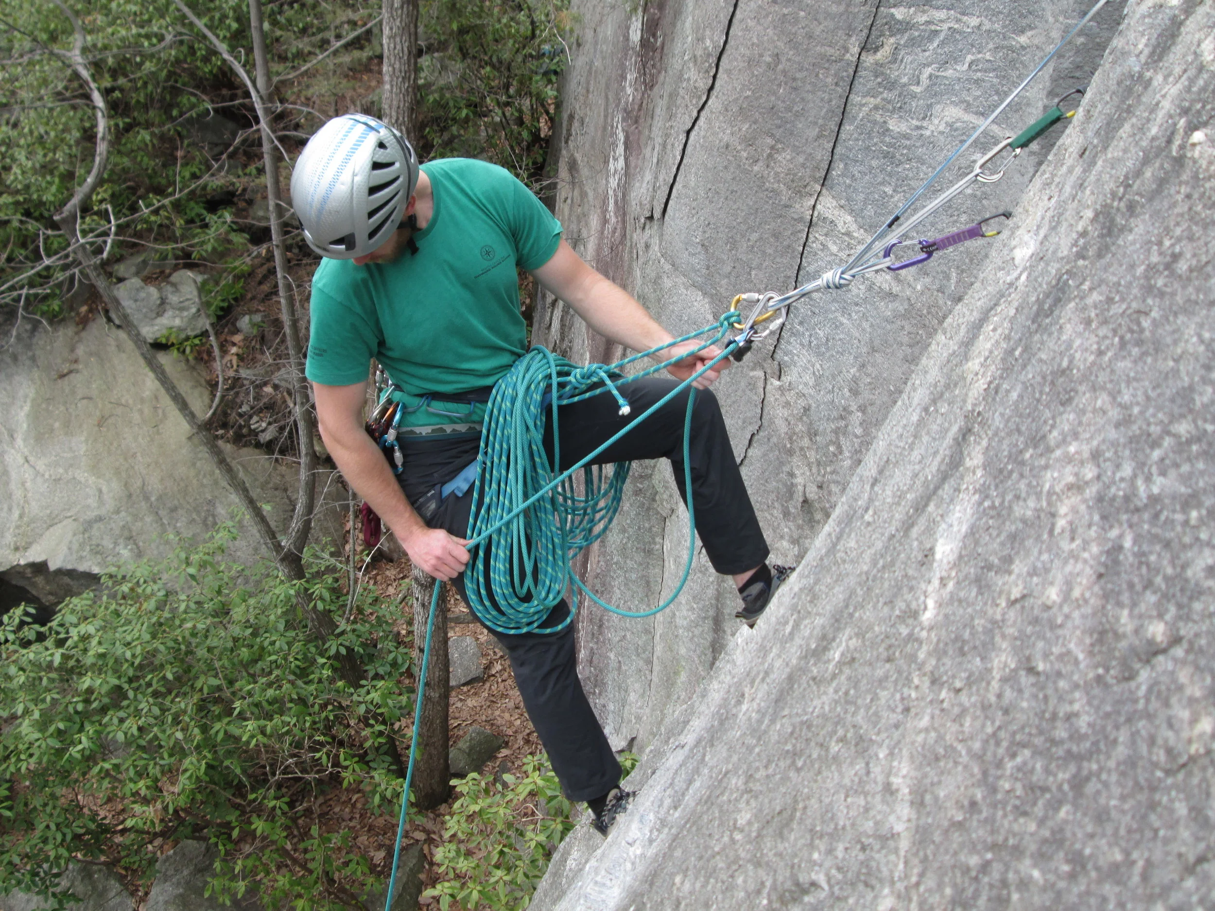 A modern belayer does not just use an anchor as a backup. As we can see, this belayer is fully committed to the load-bearing properties of the anchor. It holds his bodyweight, and the bodyweight of his second.