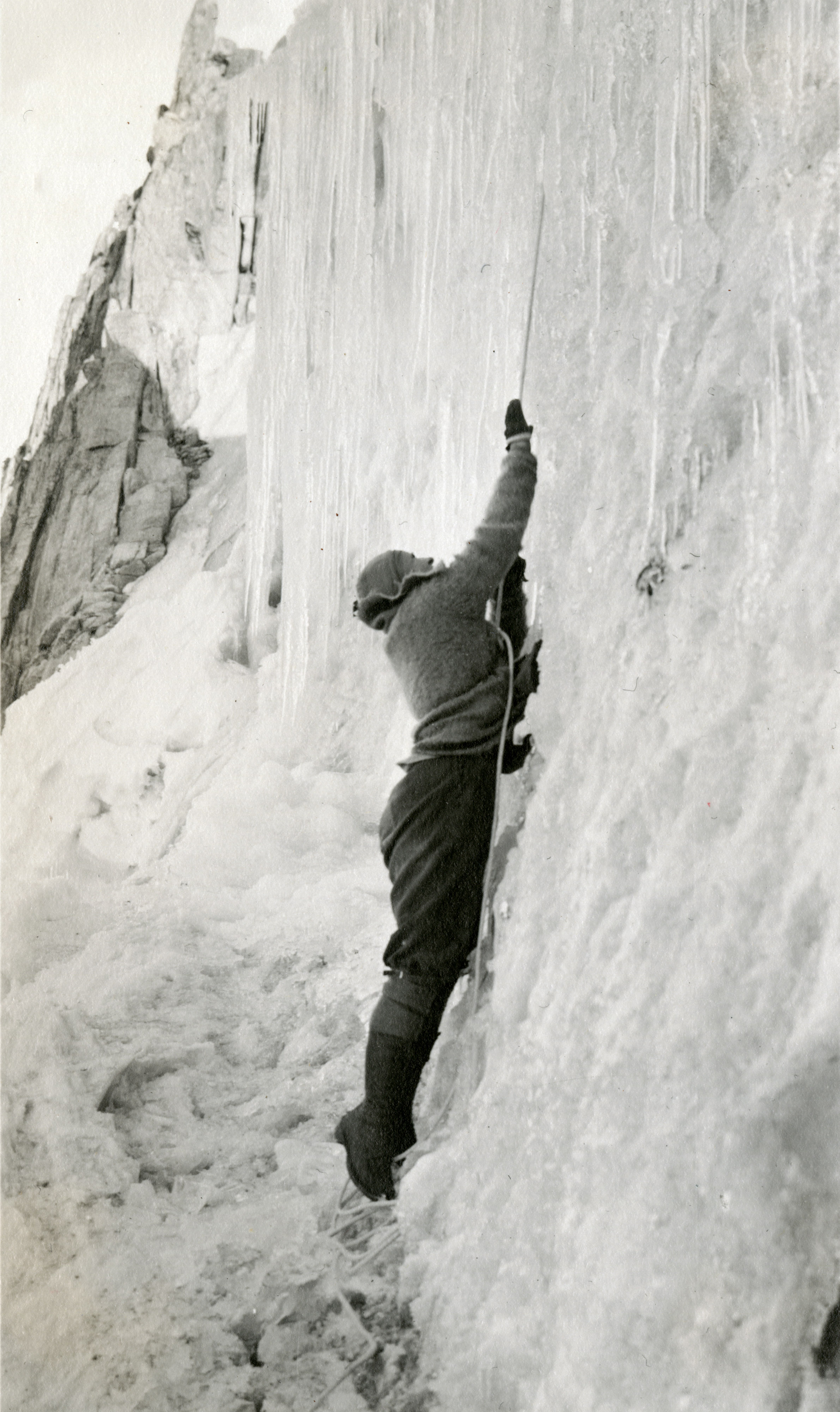 Elmina Buhl dropping into a bergschrund on Fremont Glacier in 1924