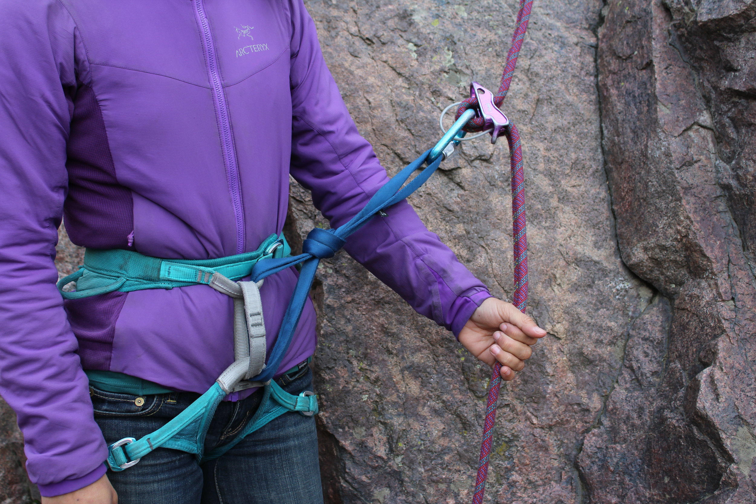 An extension built with a double length nylon sling positions a rappel device far enough from a belay loop that almost any friction hitch backup will be effective.