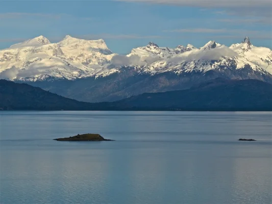 The view from Donini's home in Aysén, Chile, looking across Lago General Carrera. The high peak on the left is Monte San Valentin (4,058m), the highest mountain in Patagonia. Donini and partners have made the first ascents of two of the peaks on the right. Photo courtesy of Angela Goodacre.