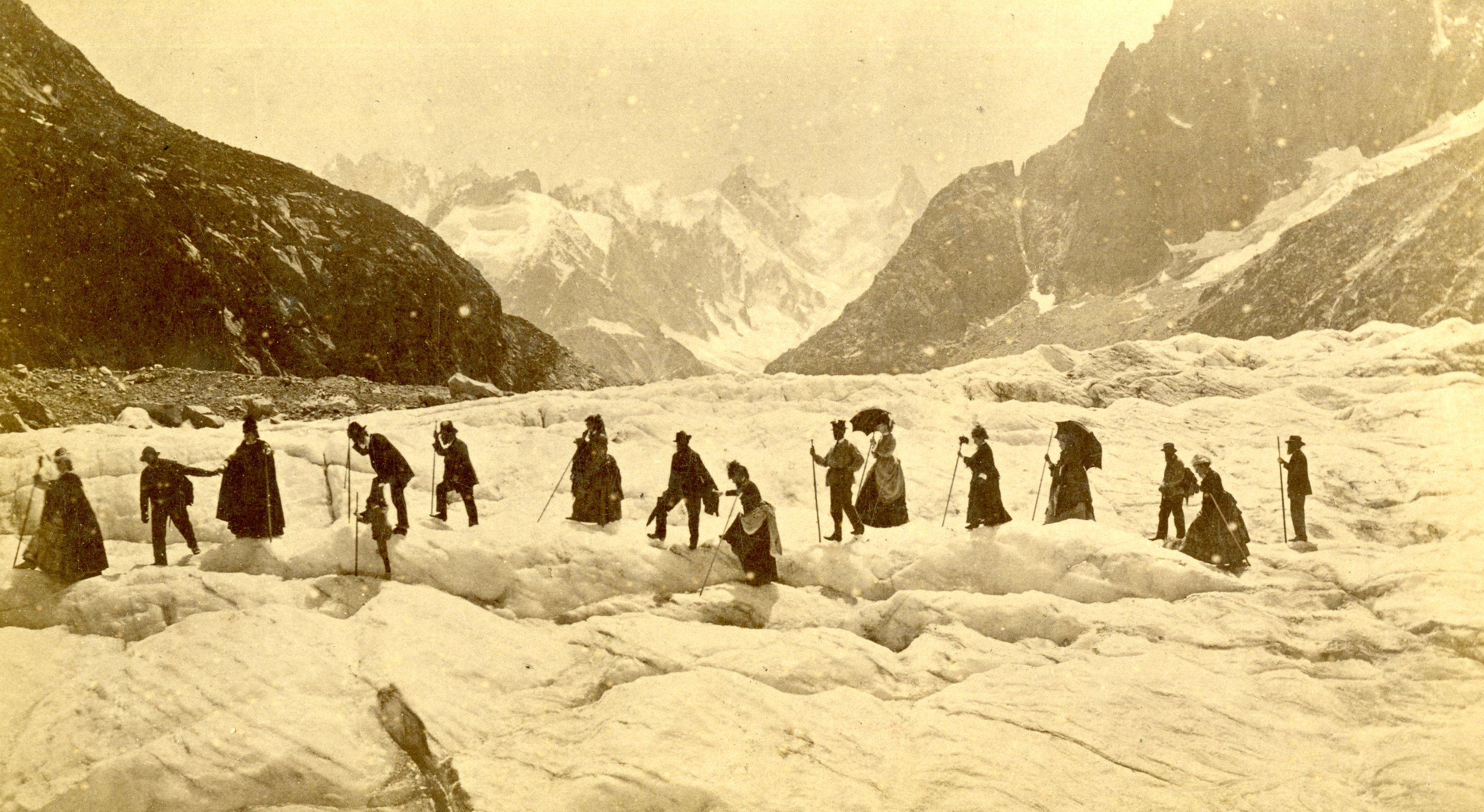  A party of mountaineers crossing a glacier in the 1870’s or 1880’s. The leader of the party used a hand axe to cut steps into the snow - the rest of the party used alpenstocks for balance. 