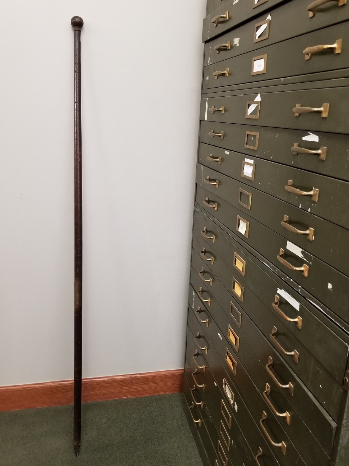  This alpenstock is of the oldest variety. It stands about five and a half feet tall and has a sharp metal spike at the bottom. 