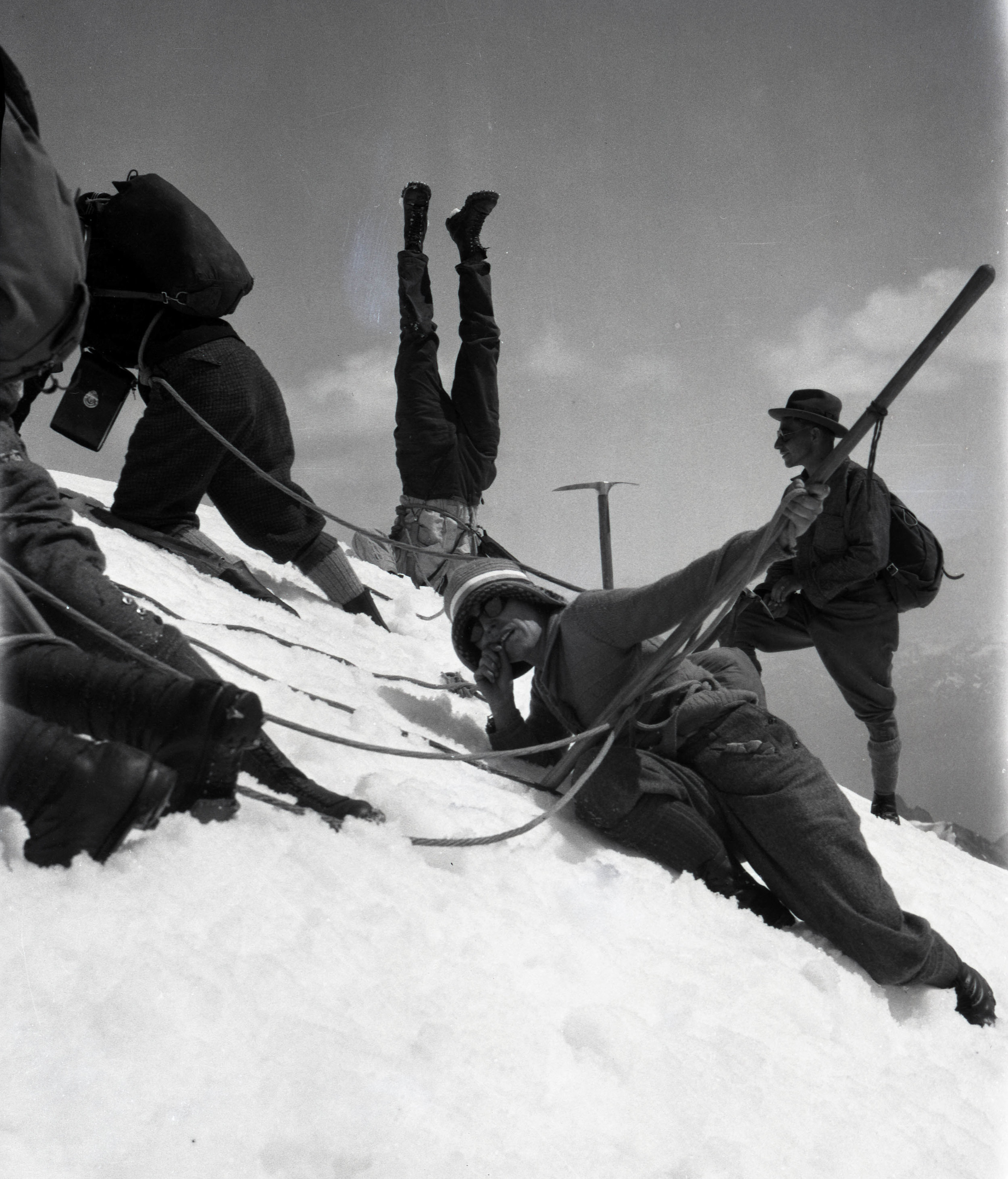  Men and women celebrating at the summit of Resplendent Mountain 