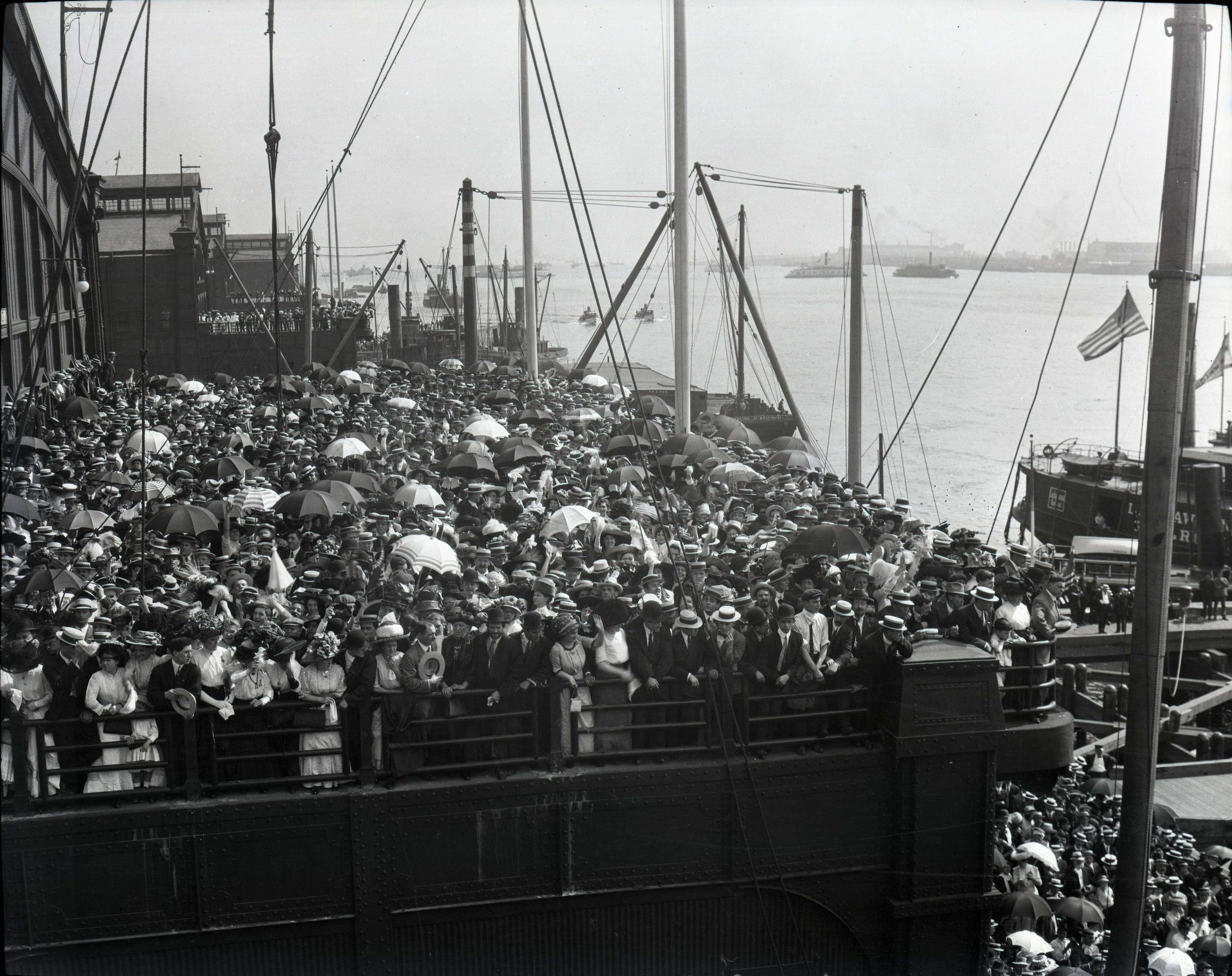 A crowd on Pier 59 in New York City where ships arrived or left