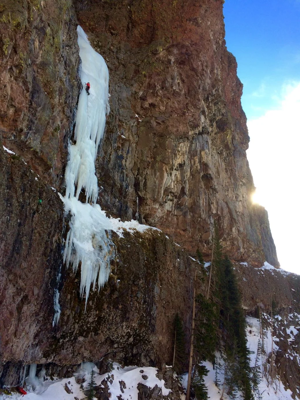 A climber on Responsible Family Man, WI5, in Hyalite Canyon, MT during the Bozeman Ice Festival. Photo Credit: Alden Pellet
