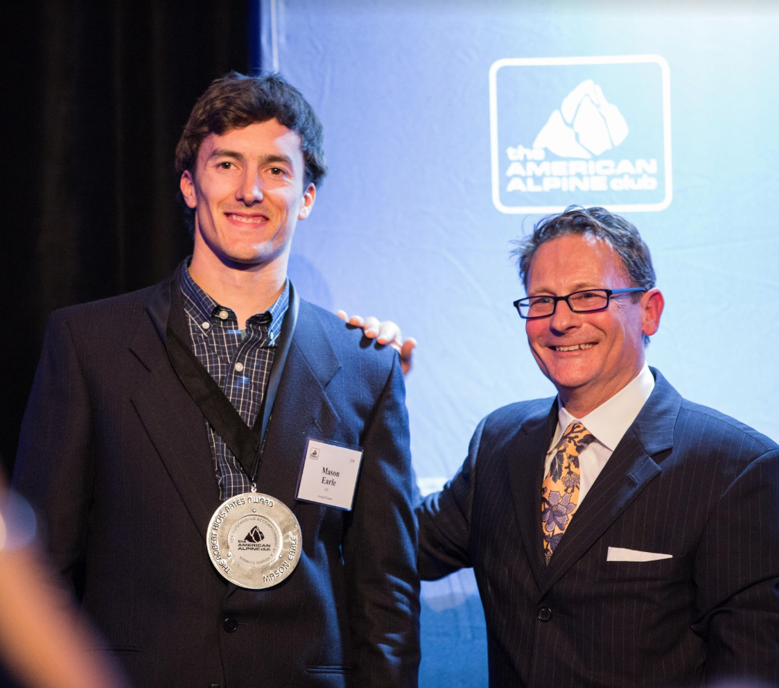 Powers with climber Mason Earle at AAC's Annual Dinner (photo: Jim Aikman).