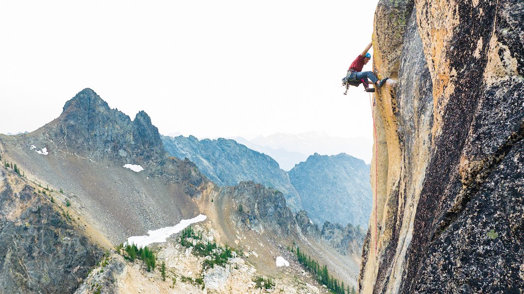  The last hard move on the 5.13 final pitch of Rubbernecker. The pocketed wall that starts this pitch was the initial objective of the entire route; the pitch continues with a wild traverse across a rail and ends with this splitter crack. 