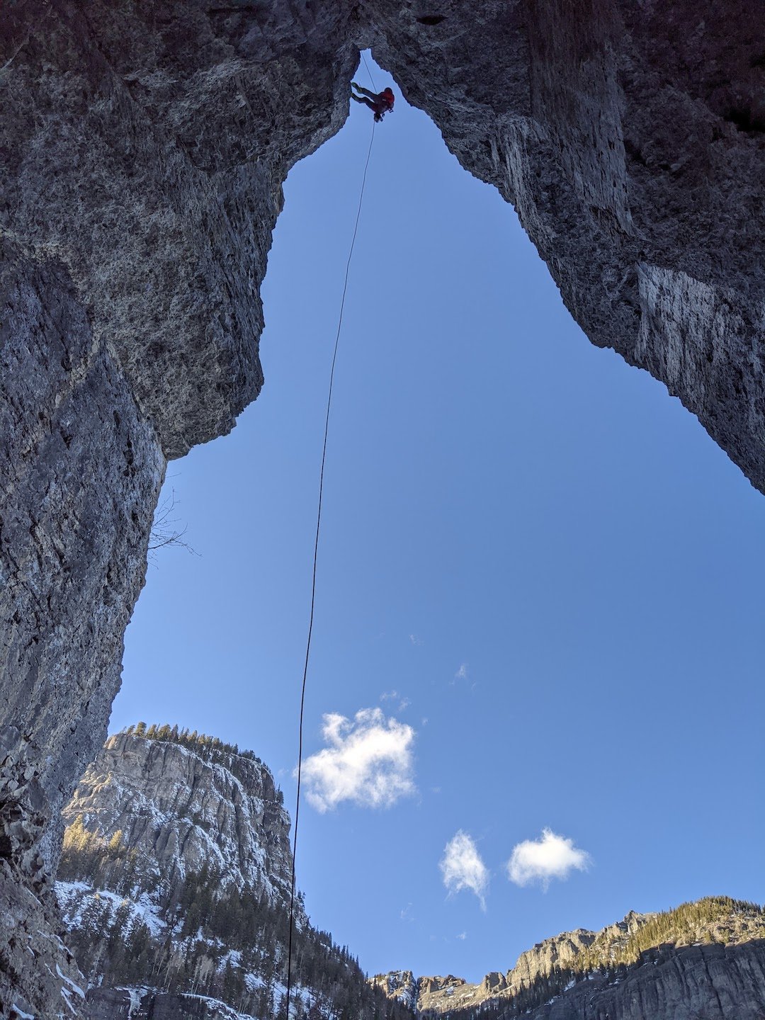  Rappelling the big cave at the base of Drop the Mic during work on the route. 