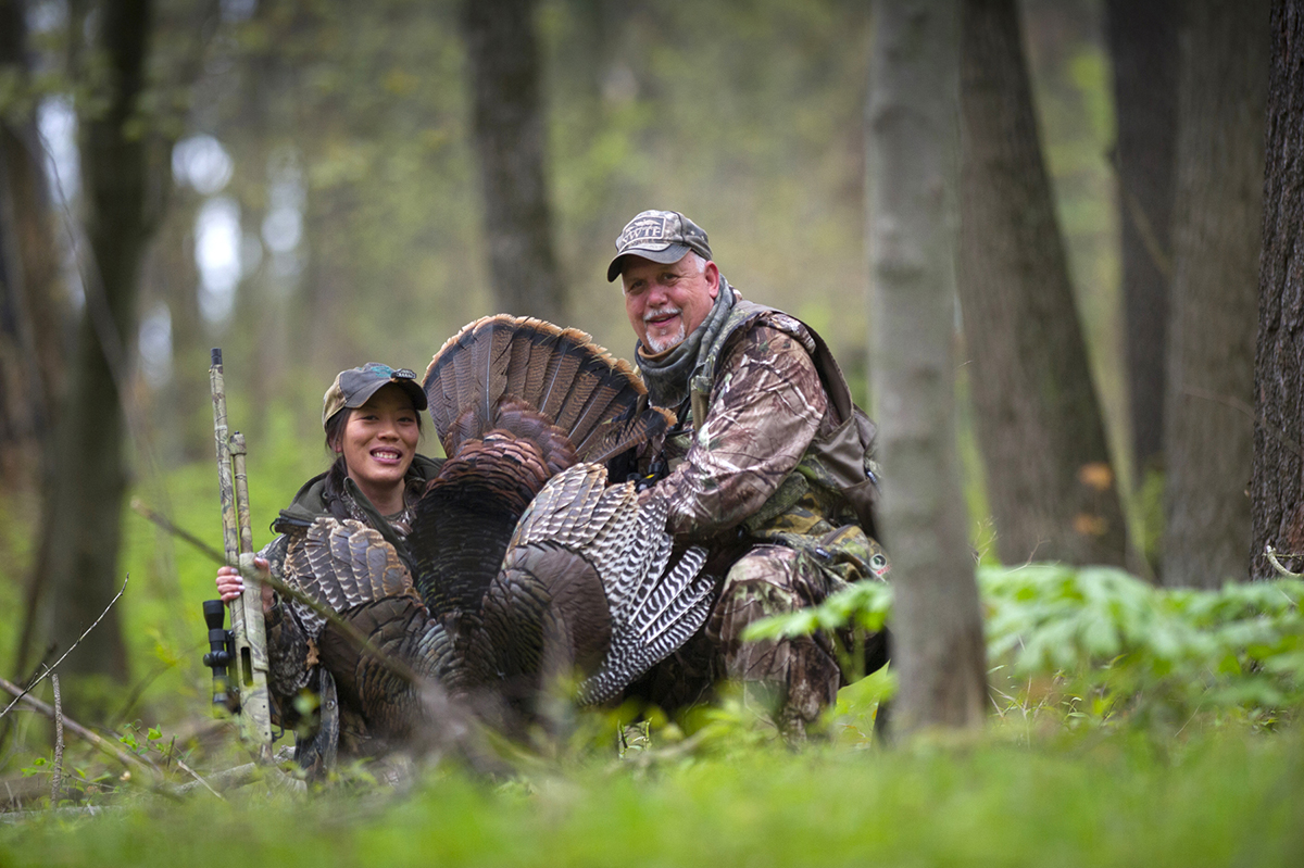 Learn to Hunt event organizer Johanna Dart with her first turkey, called in by Steve Sharp at the Barry State Game Area in Barry County./