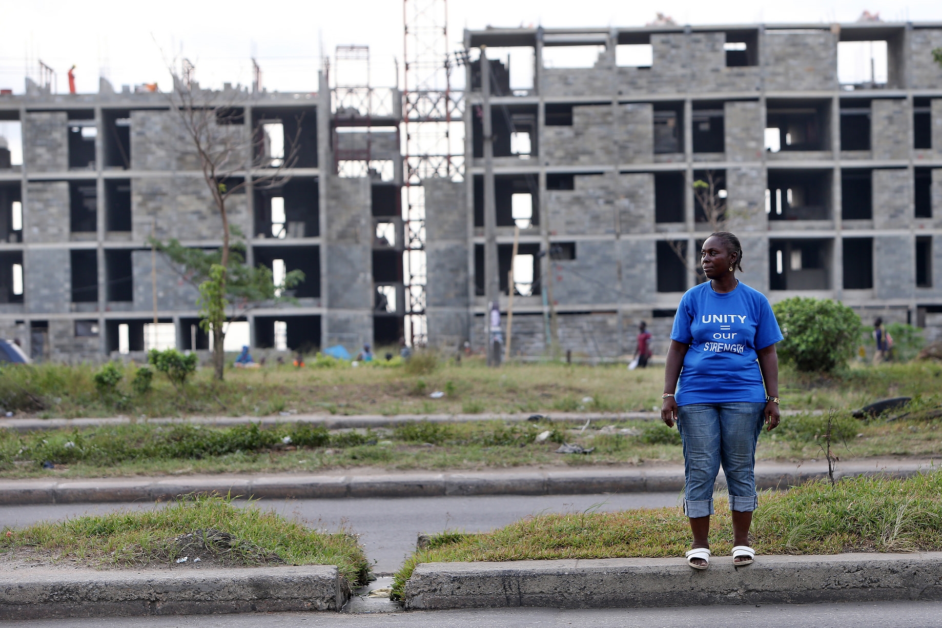 An evicted woman stands in front of what used to be Badia East slum, cleared to make space for new middle class housing developments in the urban renewal zone financed by the World Bank. Source: International Consortium of Investigative Journalists Flickr Page (CC)