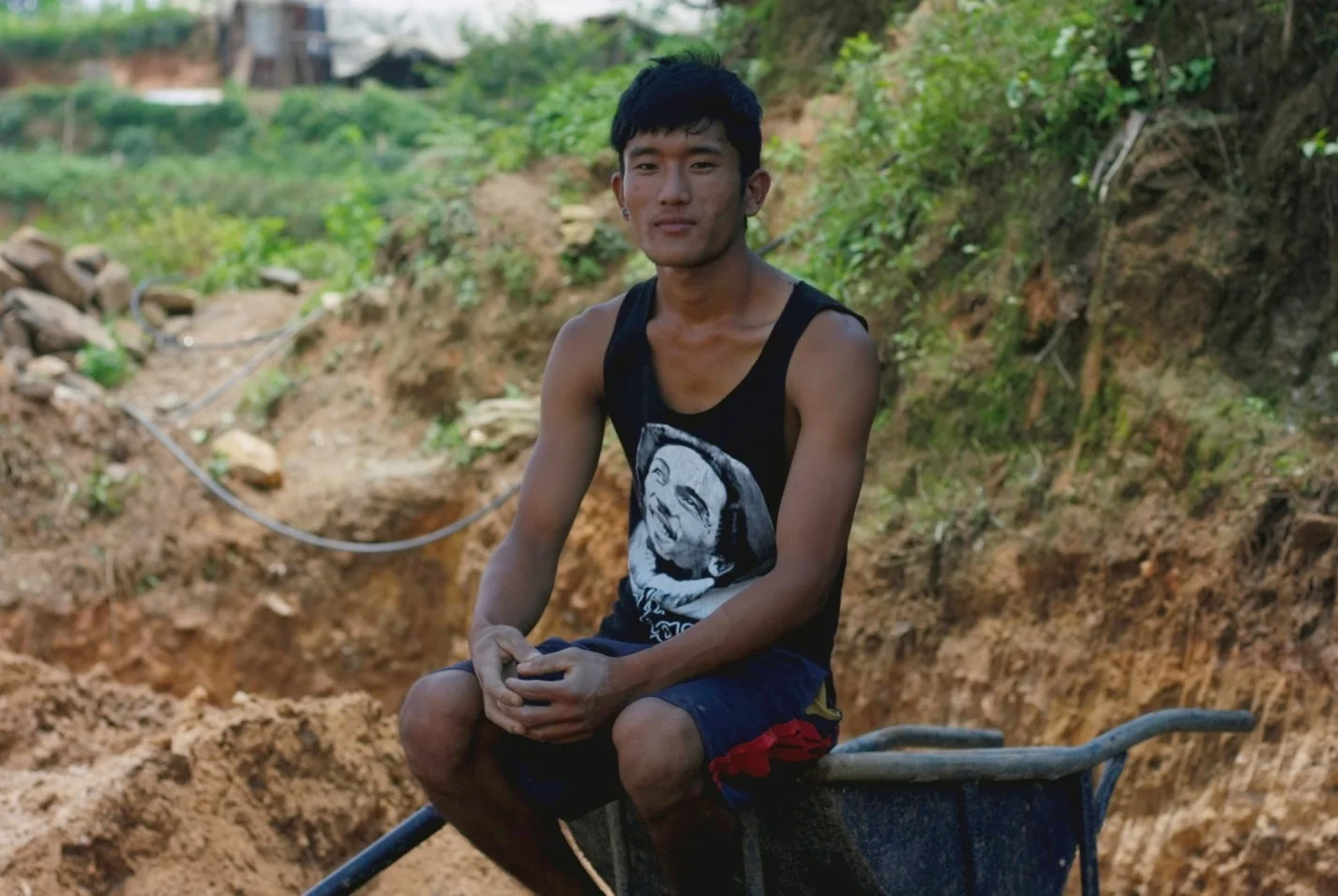 Gopi Tamang on the new patch of land he is helping to make level for the construction of his new house