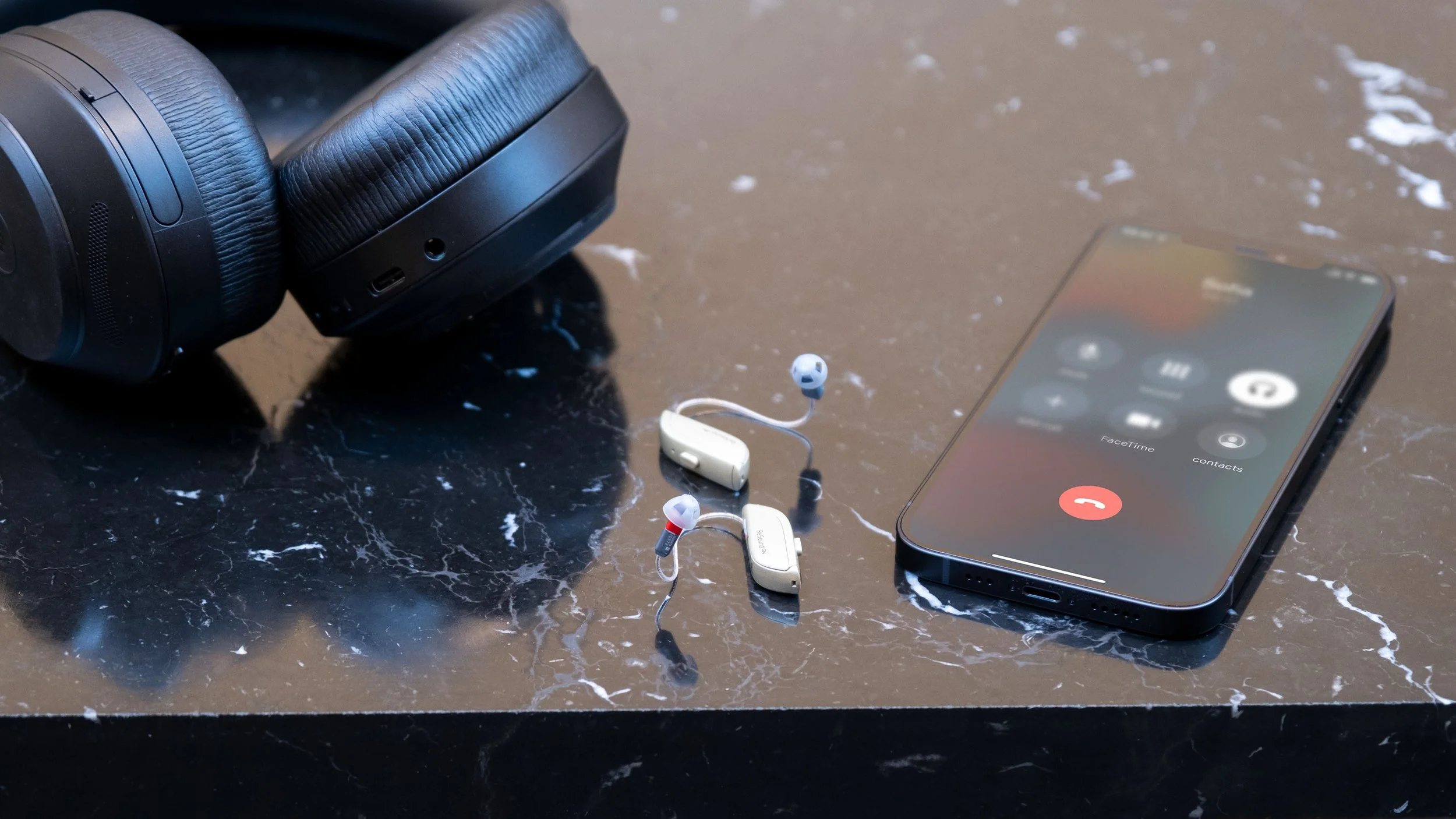hearing-aids-Carousel-3200x1800-_0003_RS_ONE_iPhone_12_Headset.jpg