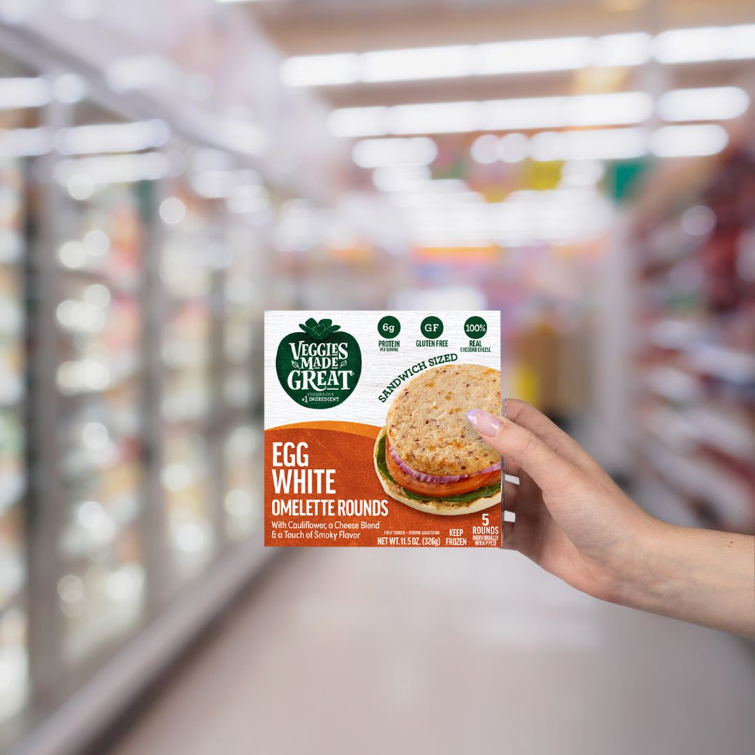 hand holding omelette round box at store