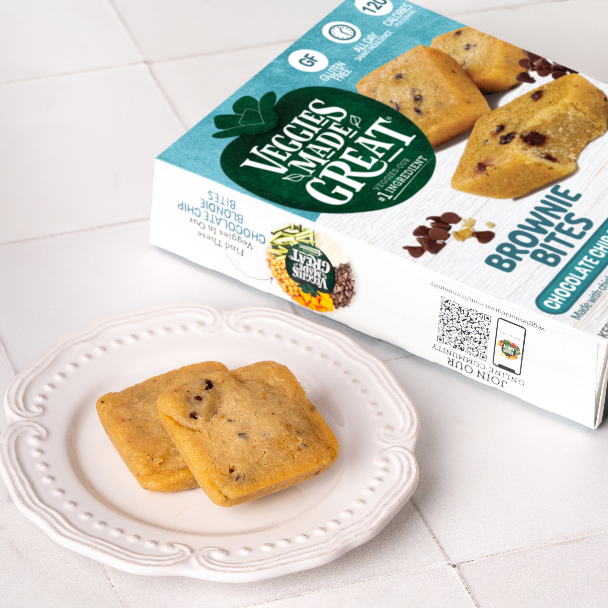 chocolate chip blondie brownie bites on plate next to box