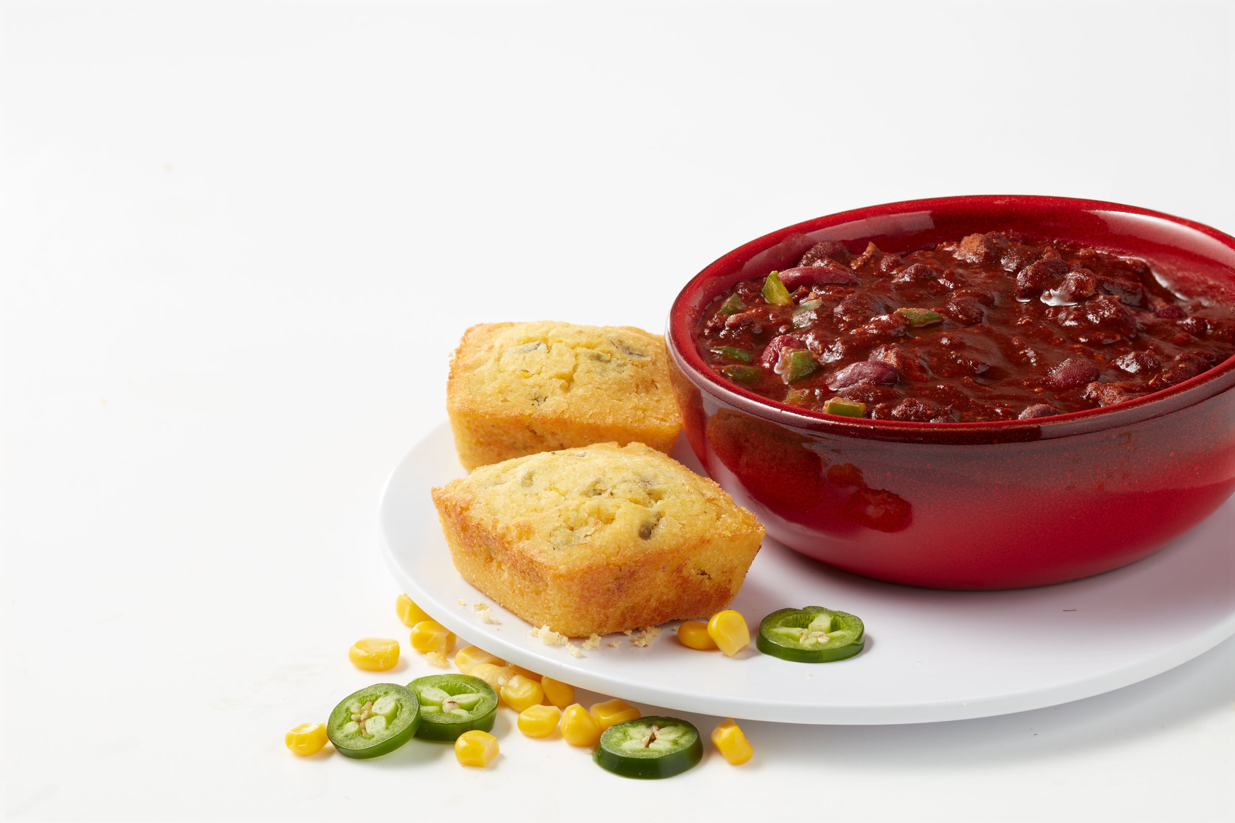 cornbread next to bowl of chili