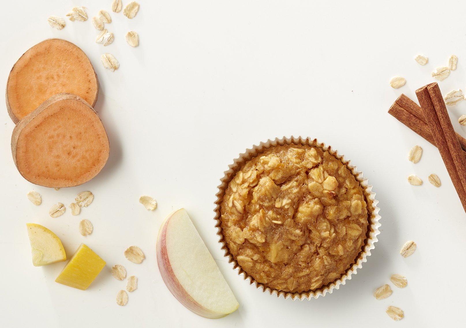 ingredients scattered around apple cinnamon oatmeal