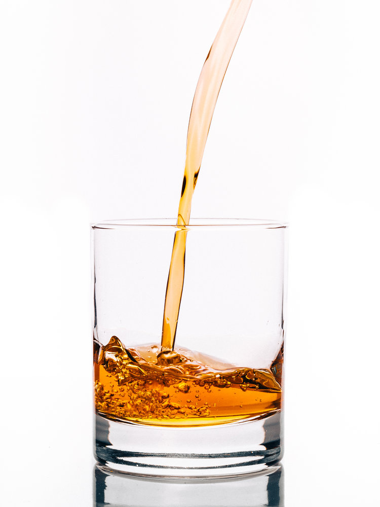 Liquor being poured into a glass.
